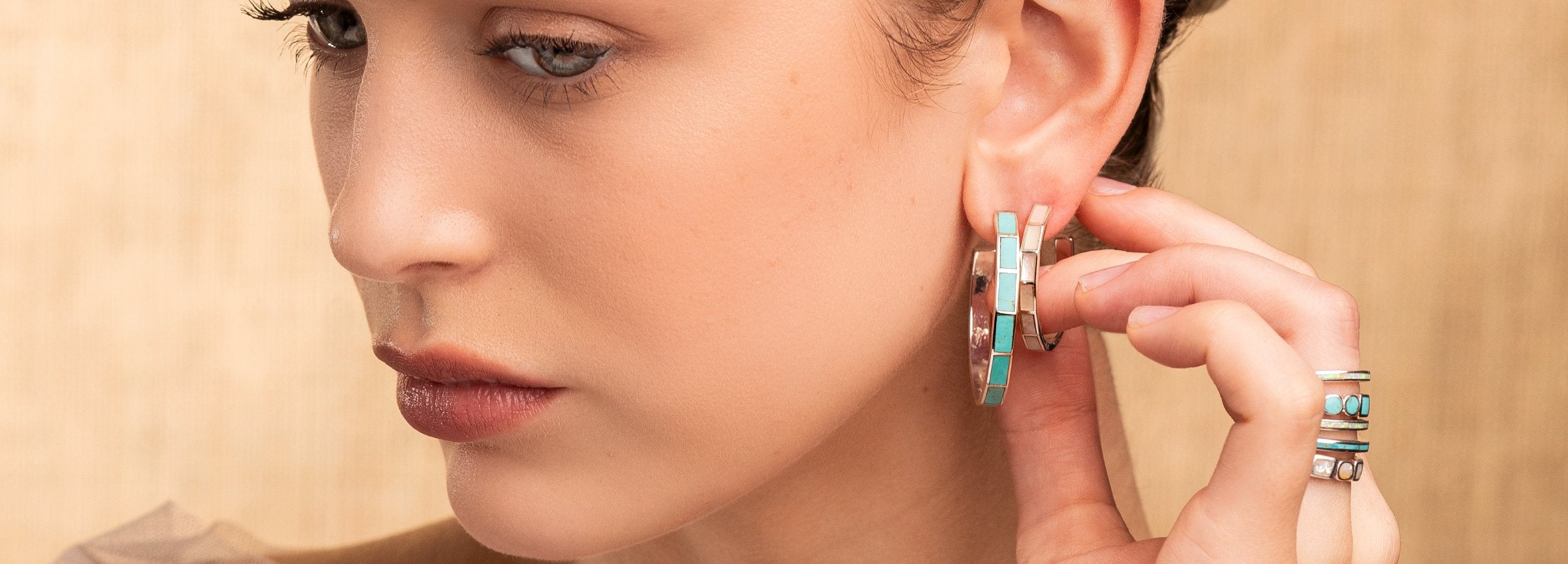 The Bird + Arrow Collection at Peyote Bird Designs celebrates the art of inlay with a modern twist. Discover Earrings, Bracelets, Rings, and Necklaces made with stones such as Turquoise, Opal, Spiny Oyster, and Lapis set in Sterling Silver.