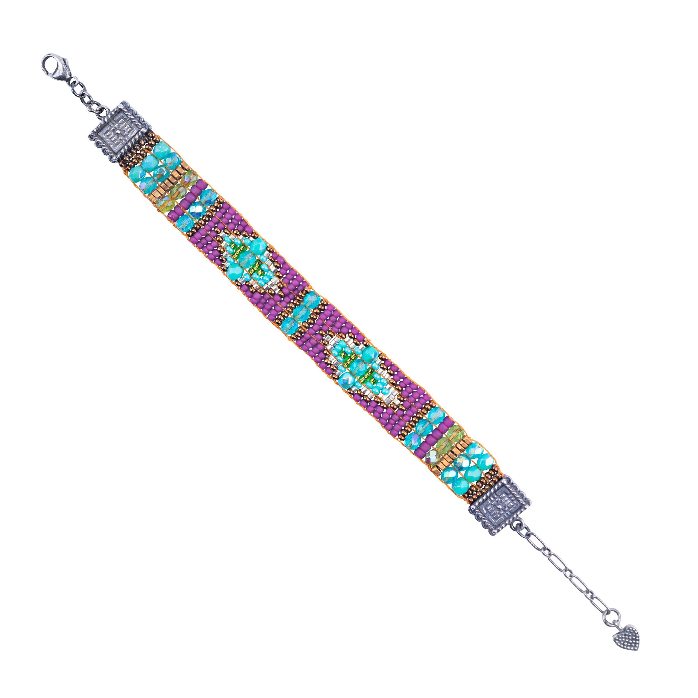 A colorful beaded bracelet with geometric patterns, featuring silver-colored clasps and beads on the ends.