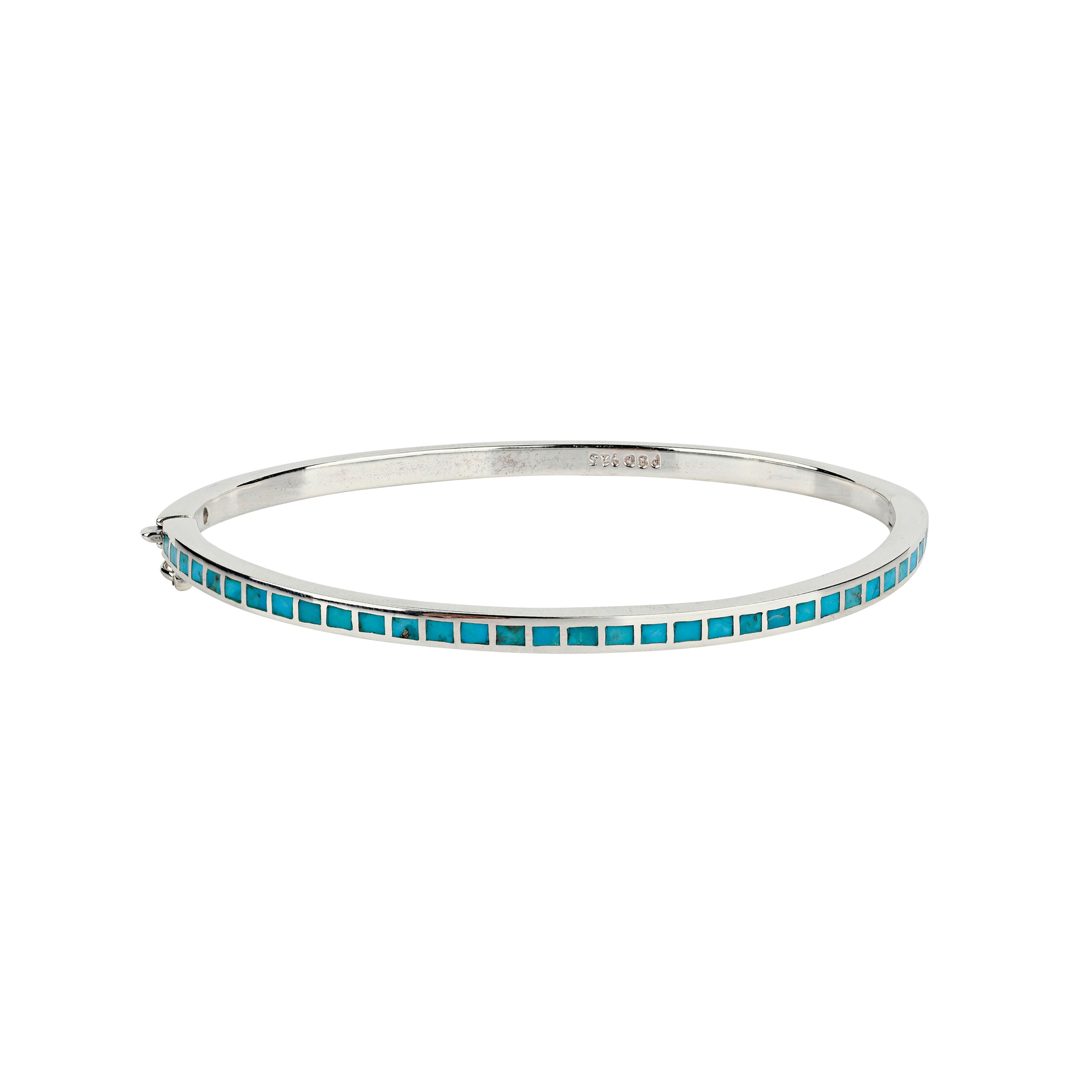 The Element Bangle is sterling silver inlayed with semi-precious stone of turquoise