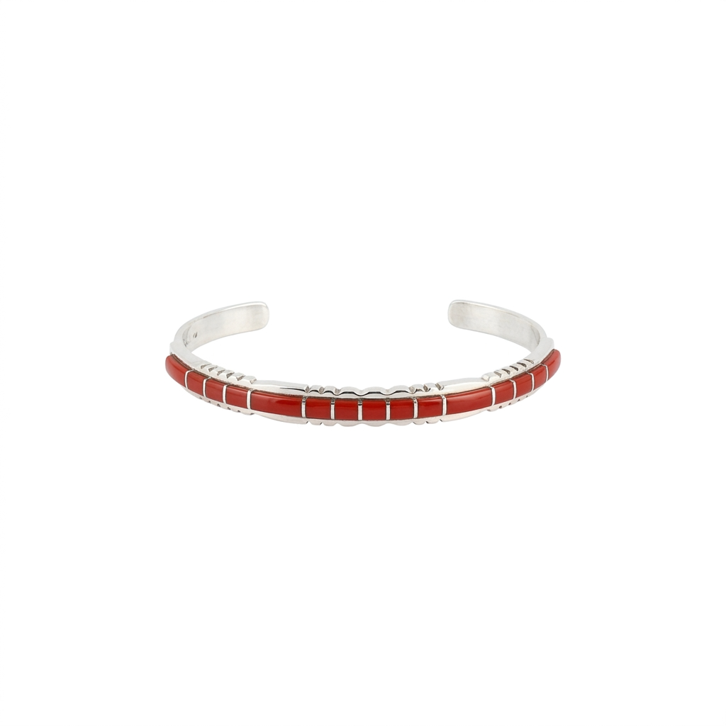 Sterling silver cuff with inlay stone detail in coral and detailing on top and bottom. front view
