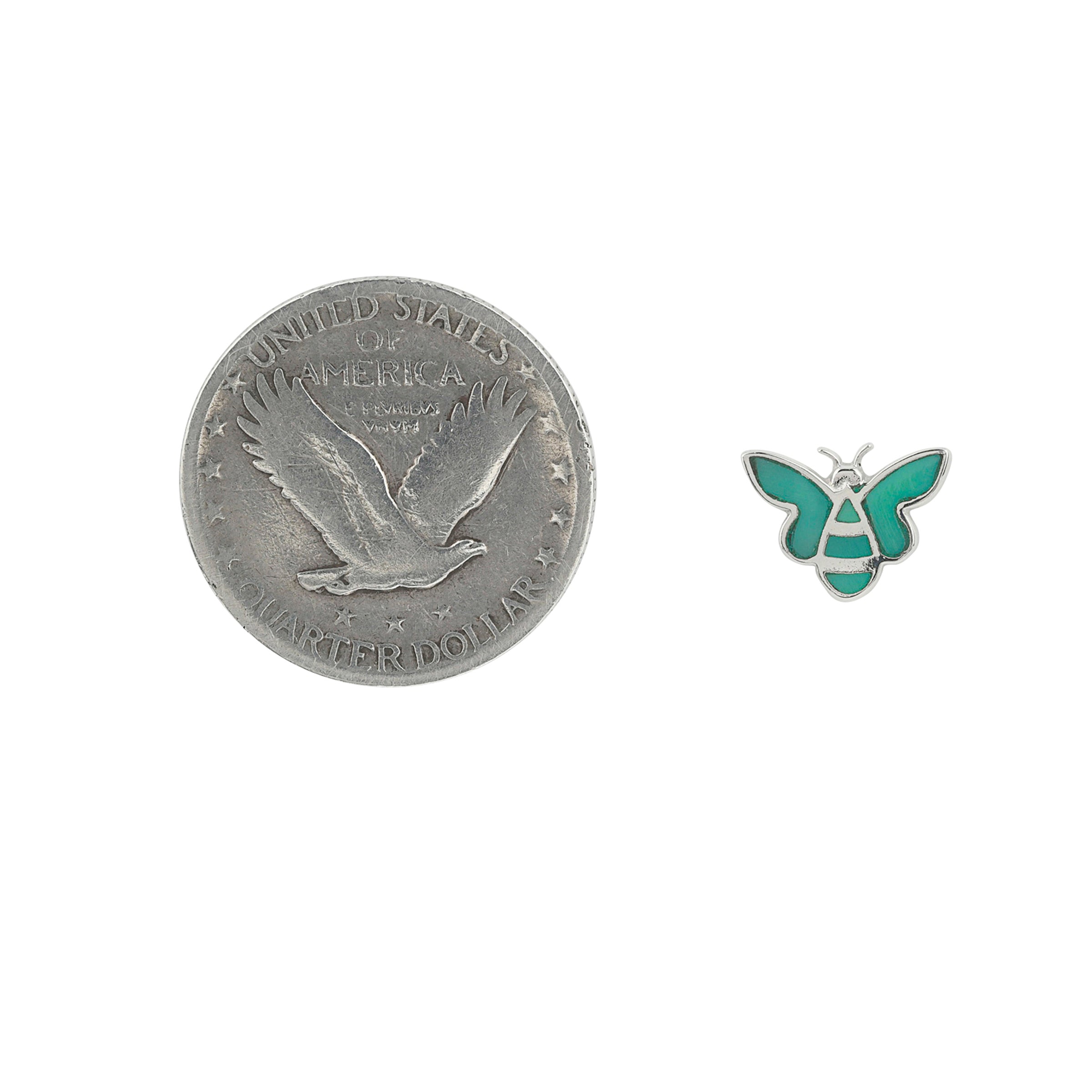 Sterling Silver bee stud earrings with green turquoise inlay next to coin for scale