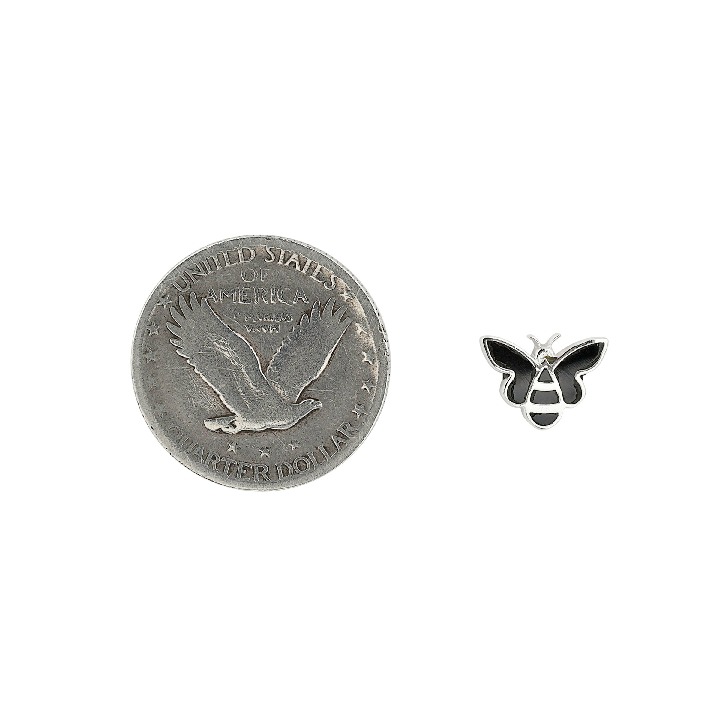 Sterling Silver bee stud earrings with black onyx inlay next to coin for scale