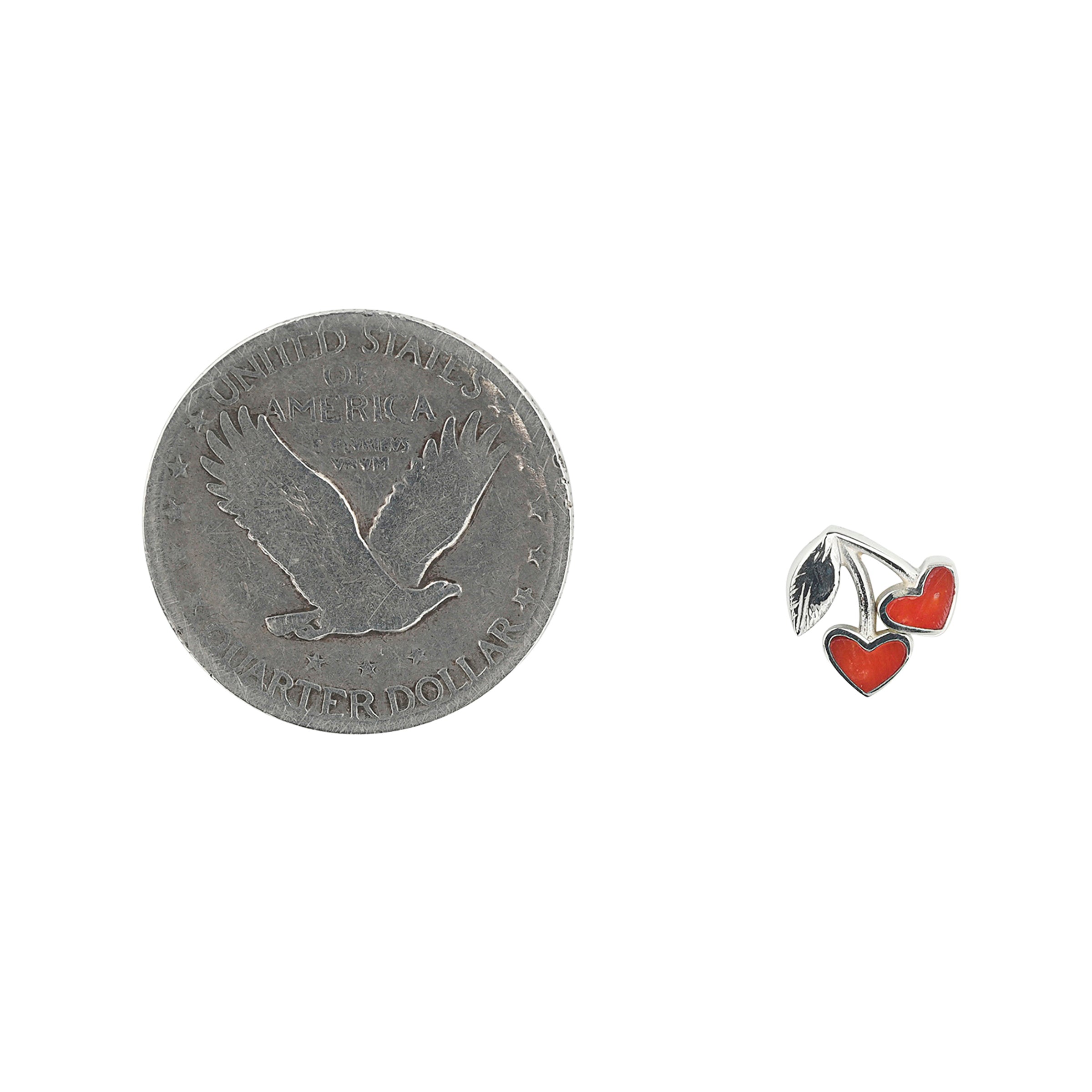 Sterling Silver cherry earrings with red coral stone inlay next to coin for scale.