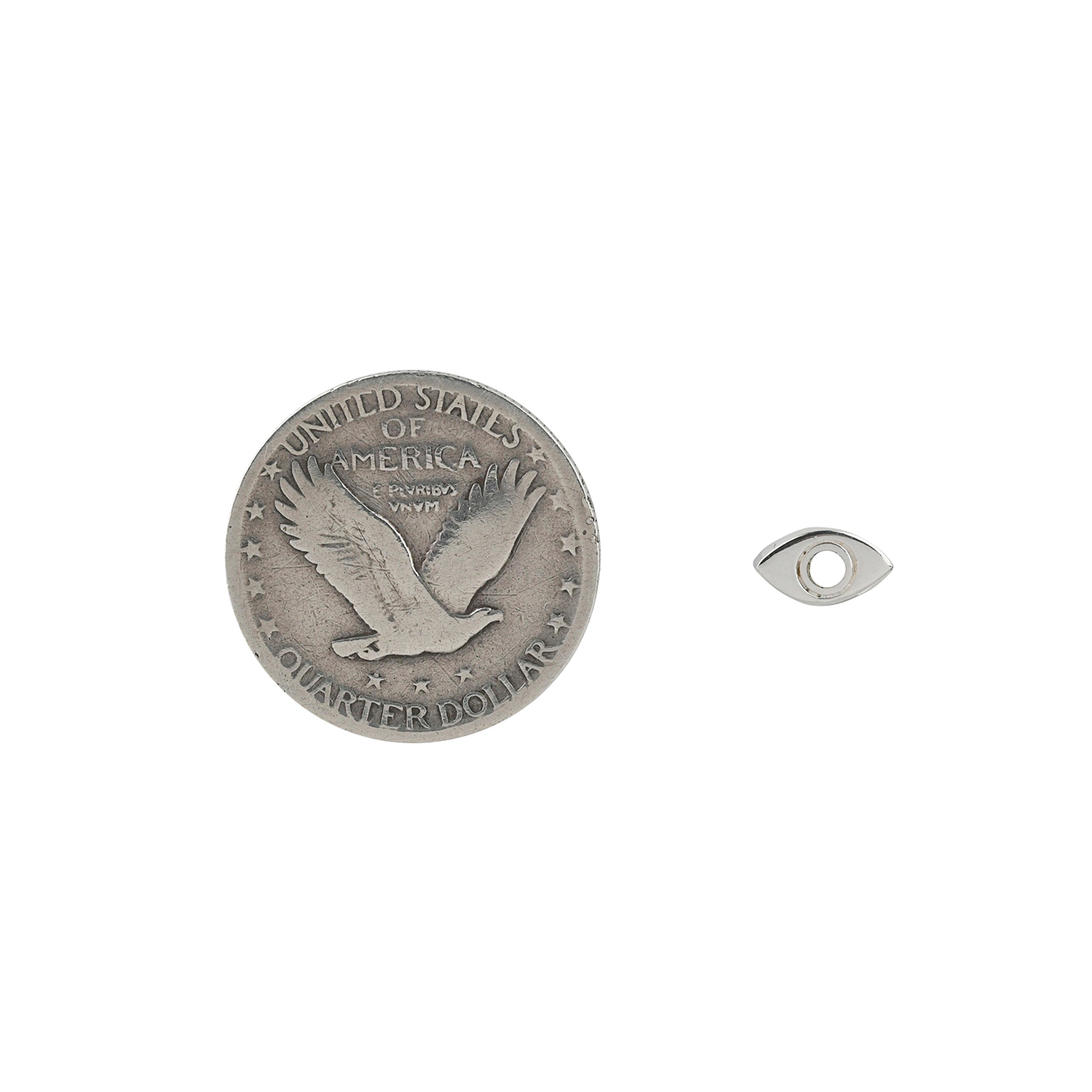 Pair of Sterling silver eye earrings with mother of pearl inlay in iris area next to coin for scale.