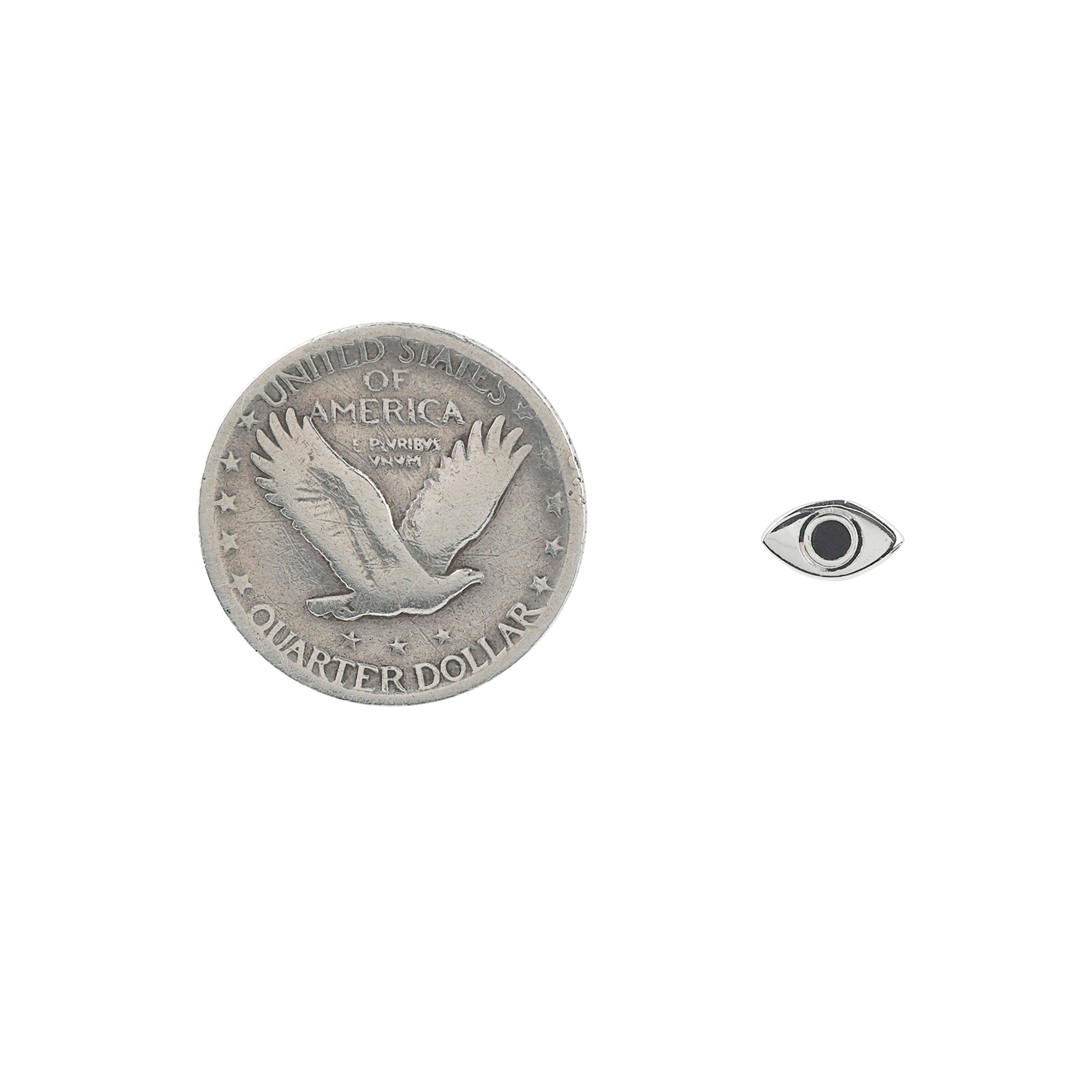 Pair of Sterling silver eye earrings with black onyx inlay in iris area next to coin for scale.