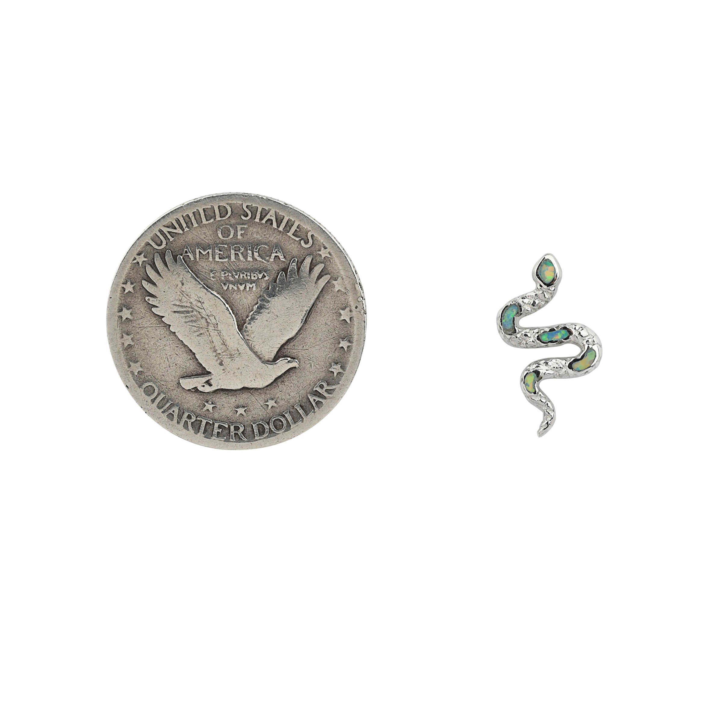 Textured Sterling Silver snake form earrings with blue opal stone inlay next to coin for scale.