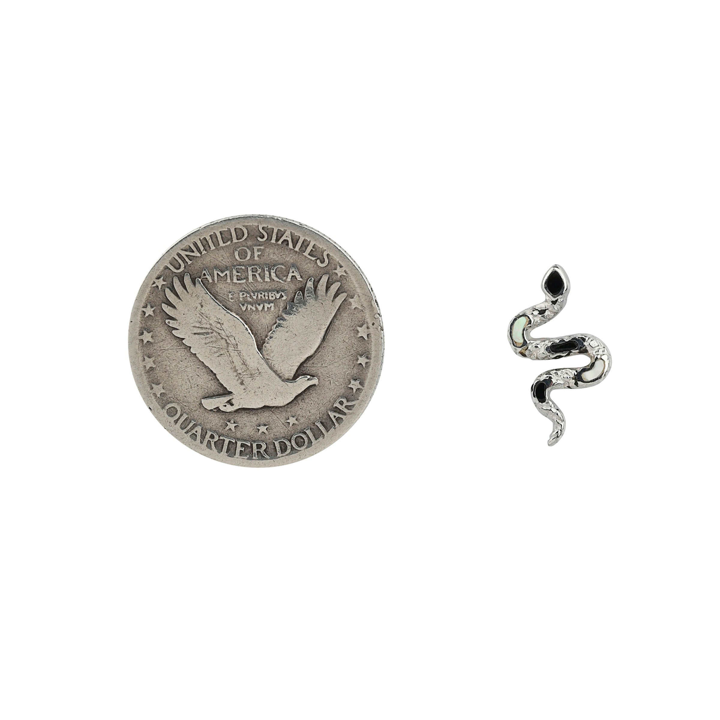 Textured Sterling Silver snake form earrings with black onyx and mother of pearl stone inlay next to coin for scale.