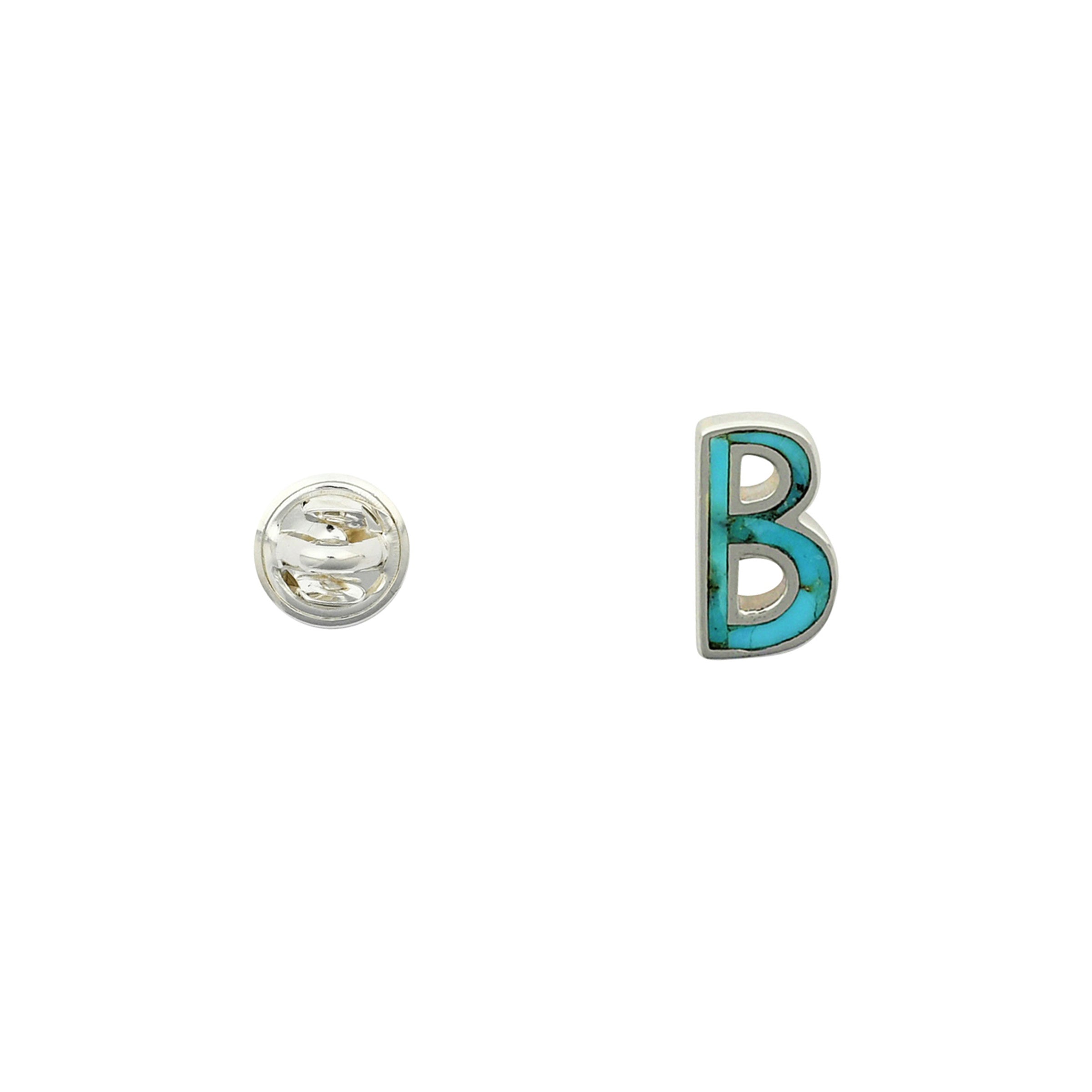 Turquoise letter pin B wrapped in sterling silver next to silver tack back.