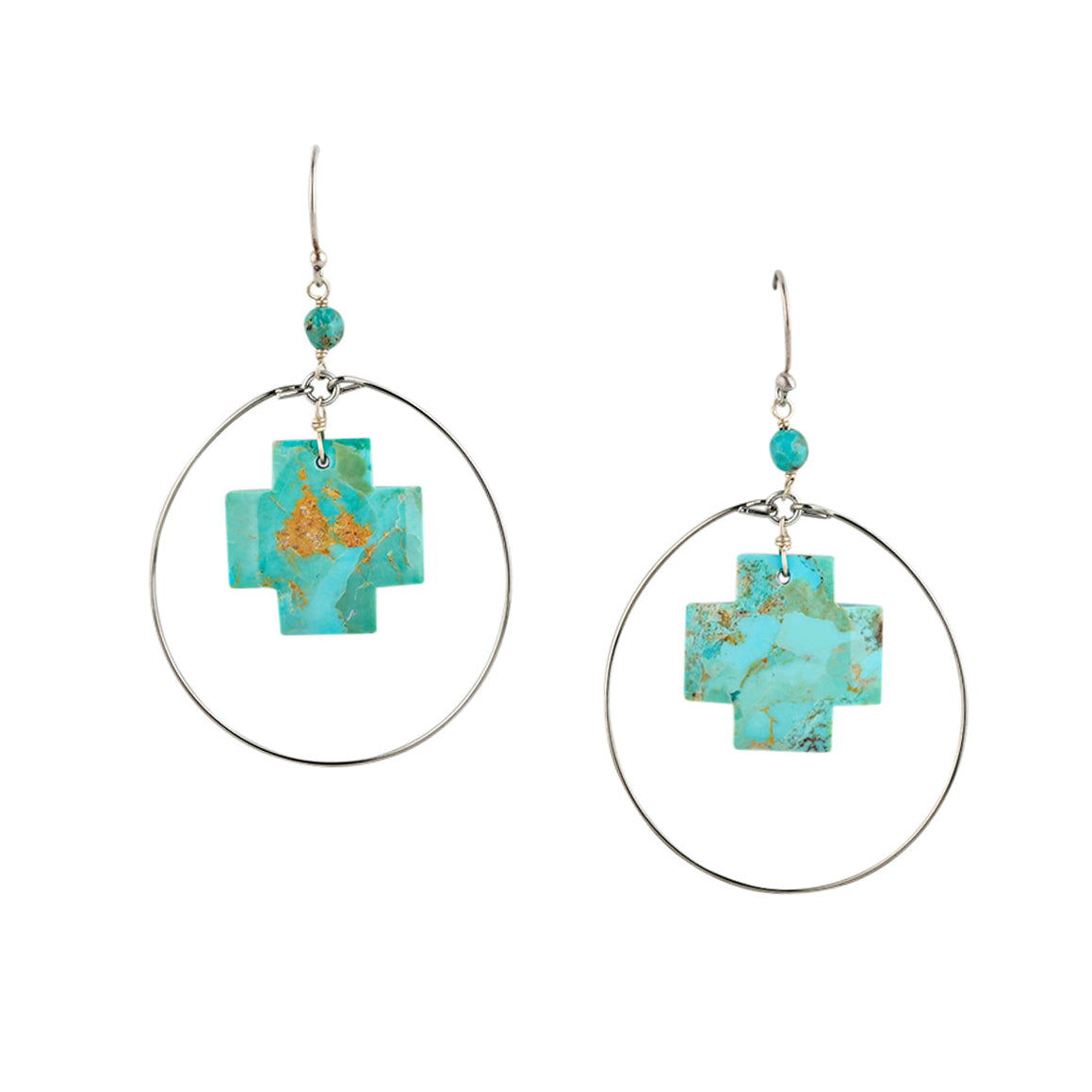 Turquoise cross earrings with silver hoop surround.