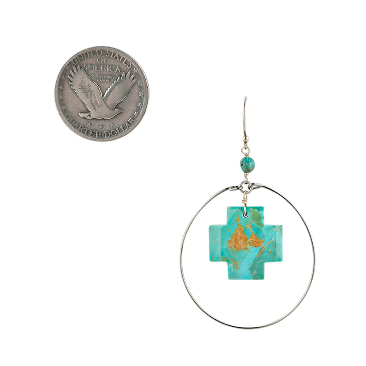 Turquoise cross earrings with silver hoop surround next to coin for scale.