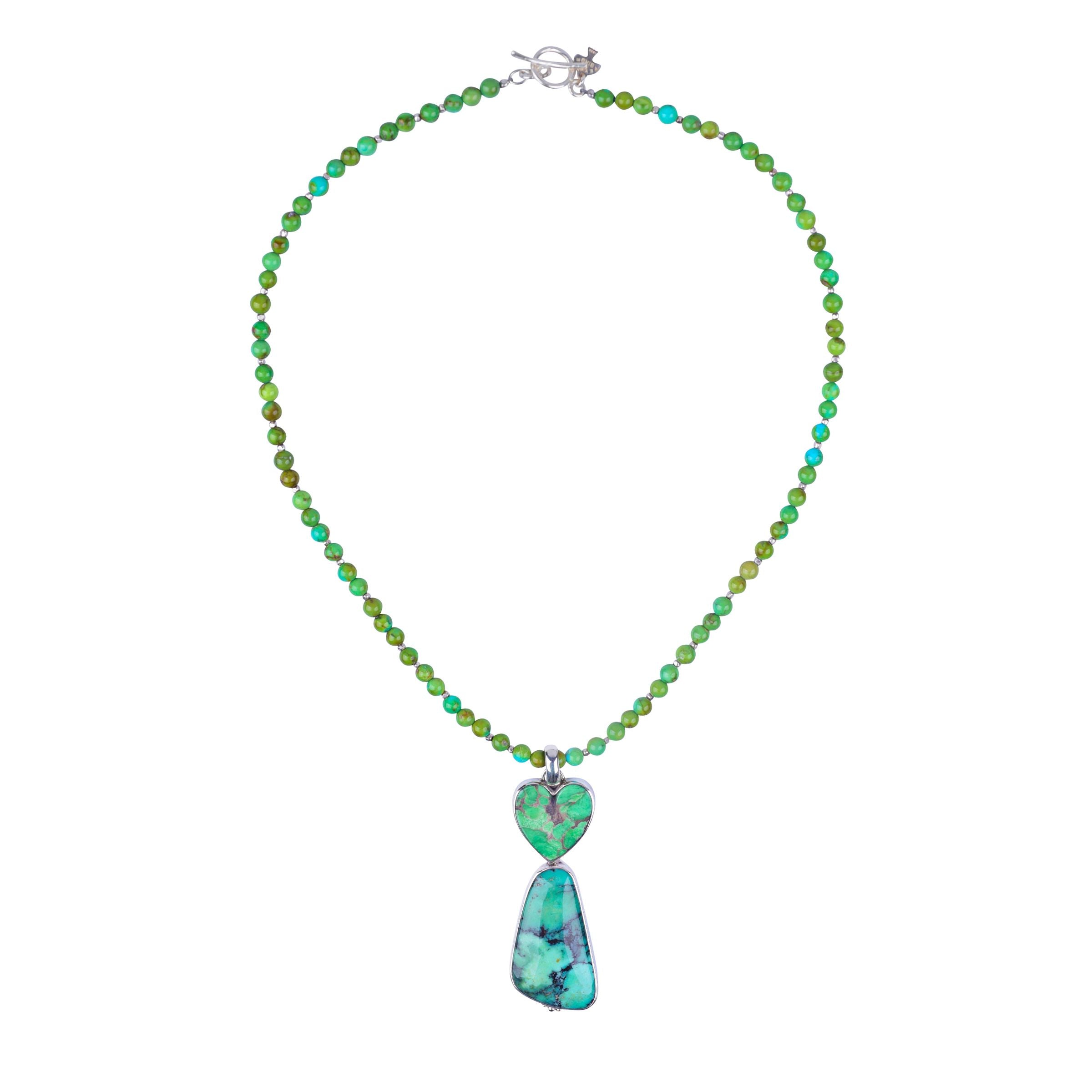 A Peyote Bird Original necklace that features sterling silver and green turquoise. With a unique green turquoise pendant. Made in USA.