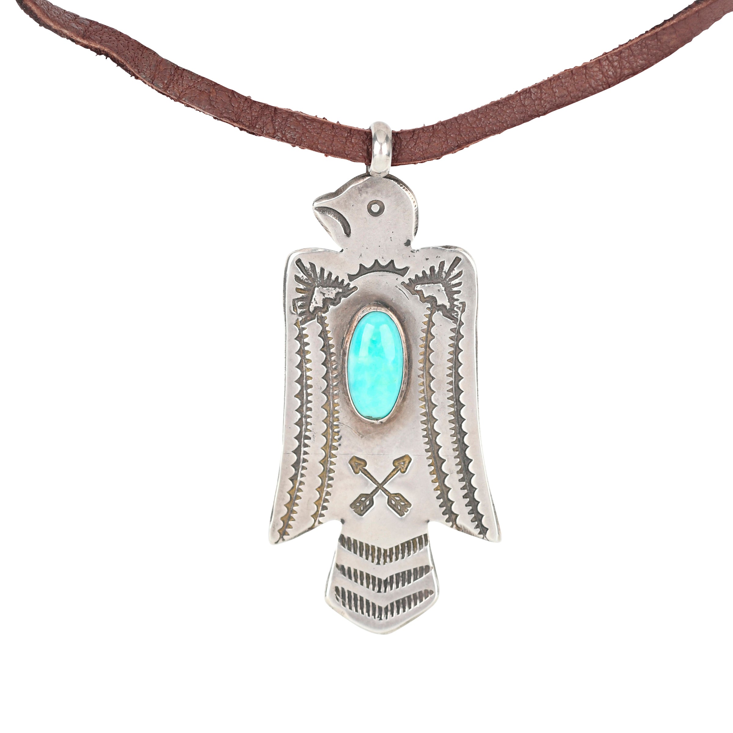 A Sterling Silver Thunderbird stamped with arrows and Southwestern patterning. Featuring a cab of Blue Turquoise as the centerpiece of the bird. Strung on Deerskin Leather for a comfortable fit.