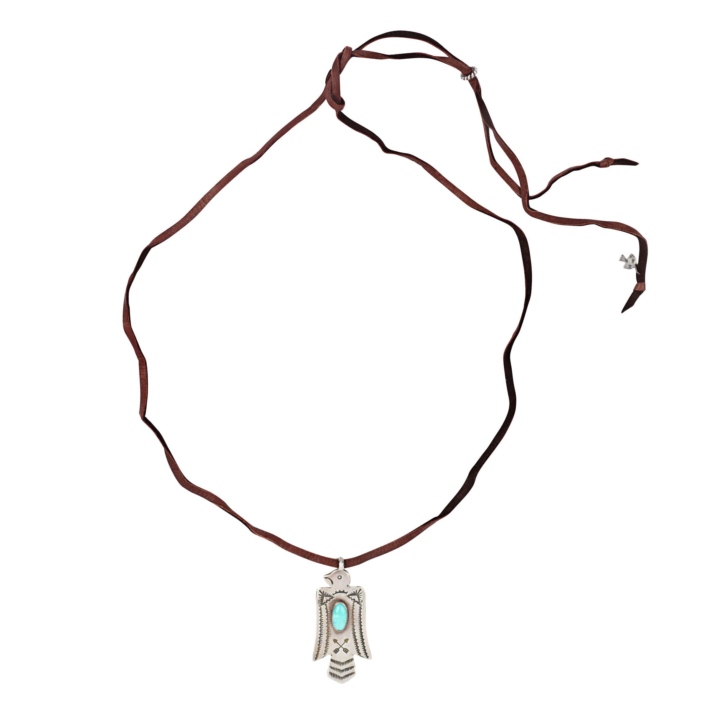 A Sterling Silver Thunderbird stamped with arrows and Southwestern patterning. Featuring a cab of Blue Turquoise as the centerpiece of the bird. Strung on Deerskin Leather for a comfortable fit.