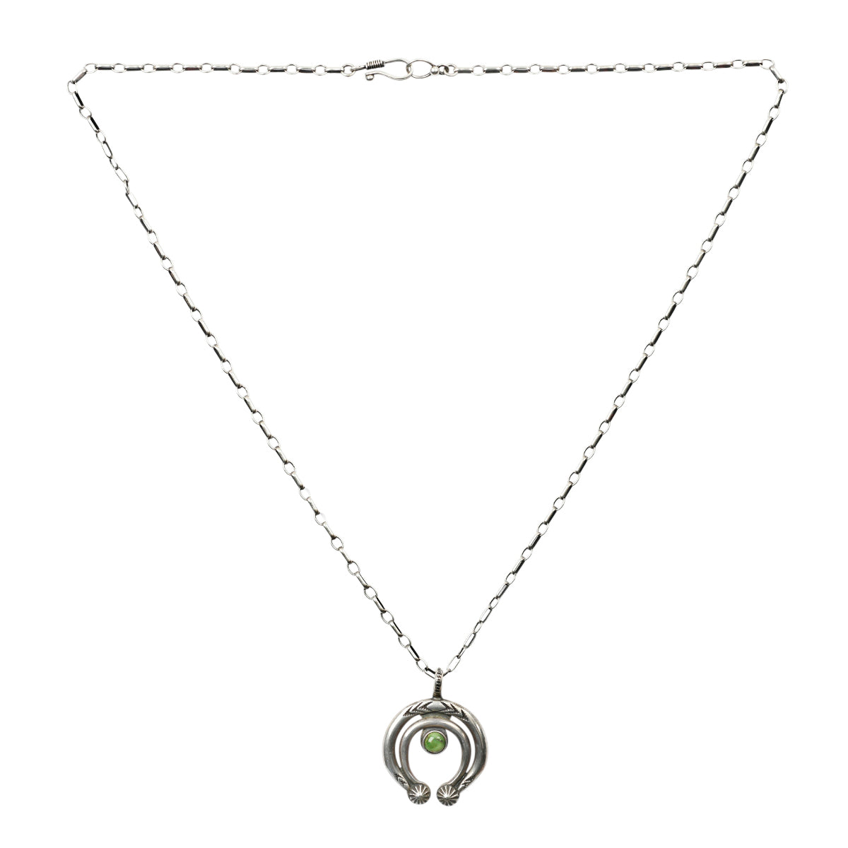 Classic Naja pendant featuring Southwestern motifs and a round of Green Turquoise strung on sterling silver chain.