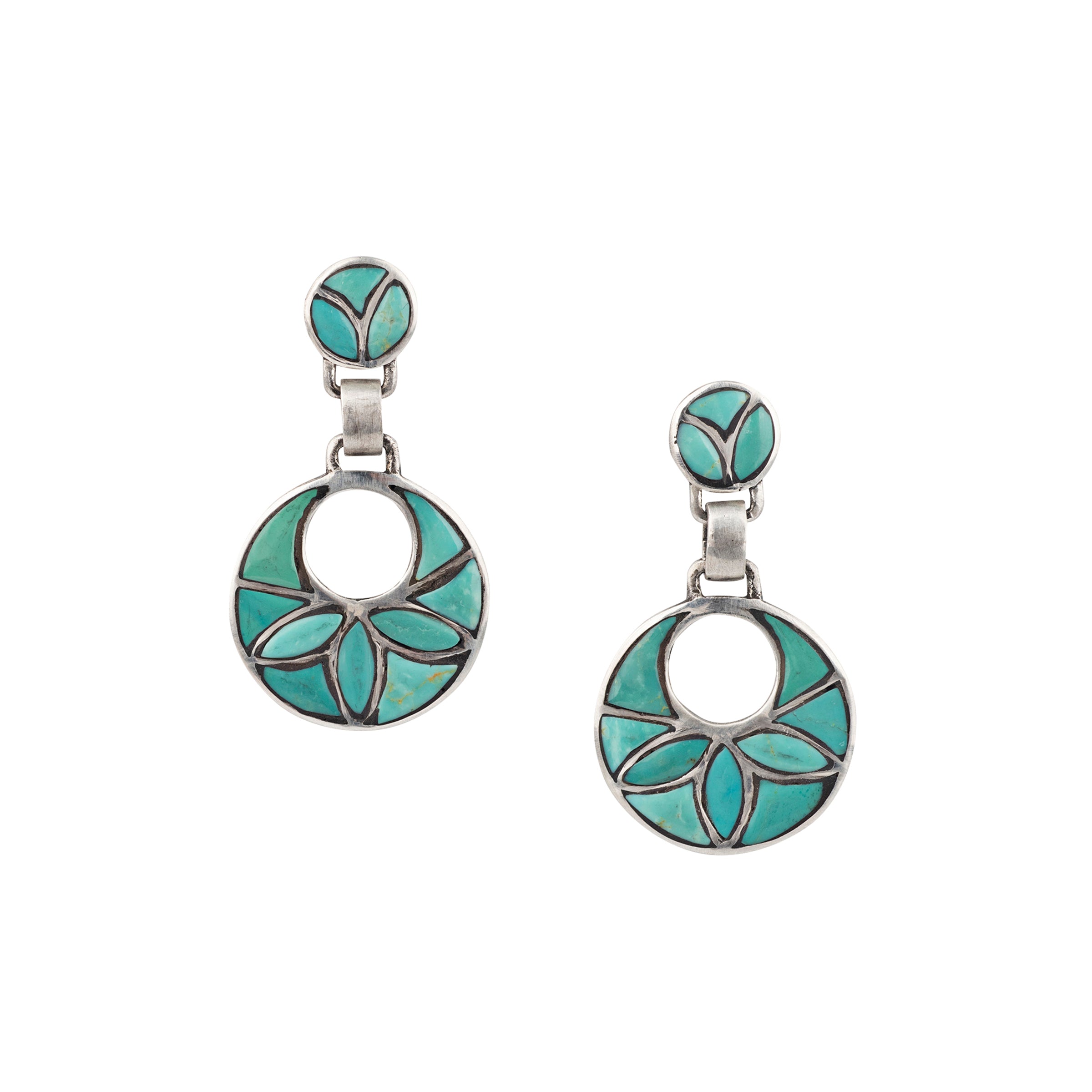 A pair of blue turquoise lotus earrings with a circular design and leaf patterns, set in sterling silver.
