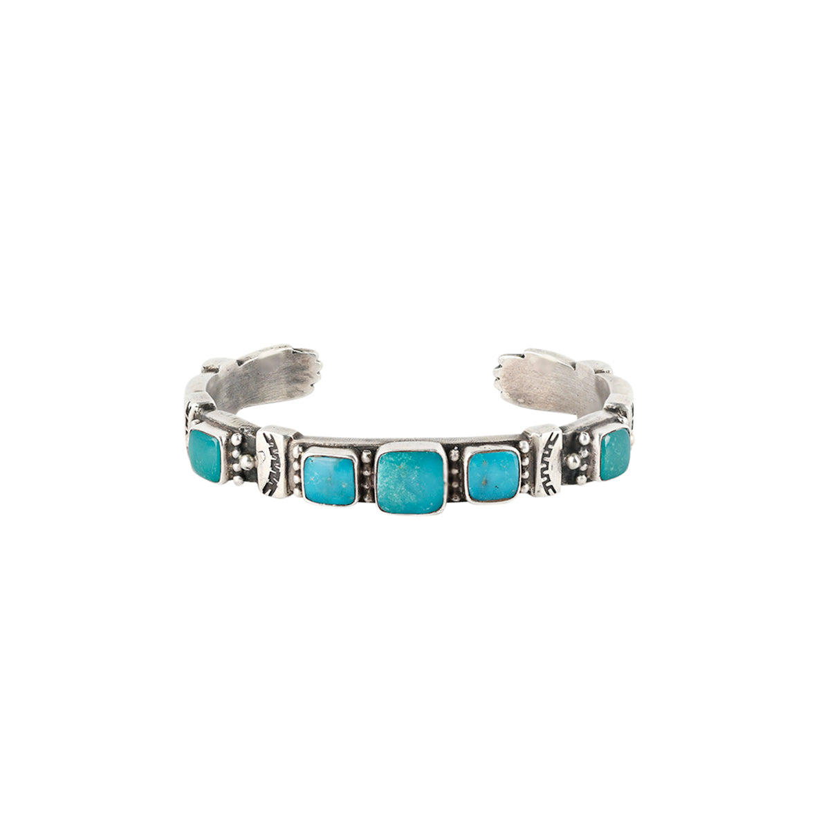 Ingot coin silver cuff with Turquoise inlay and hand design detailing on the terminals by Aldrich Art.