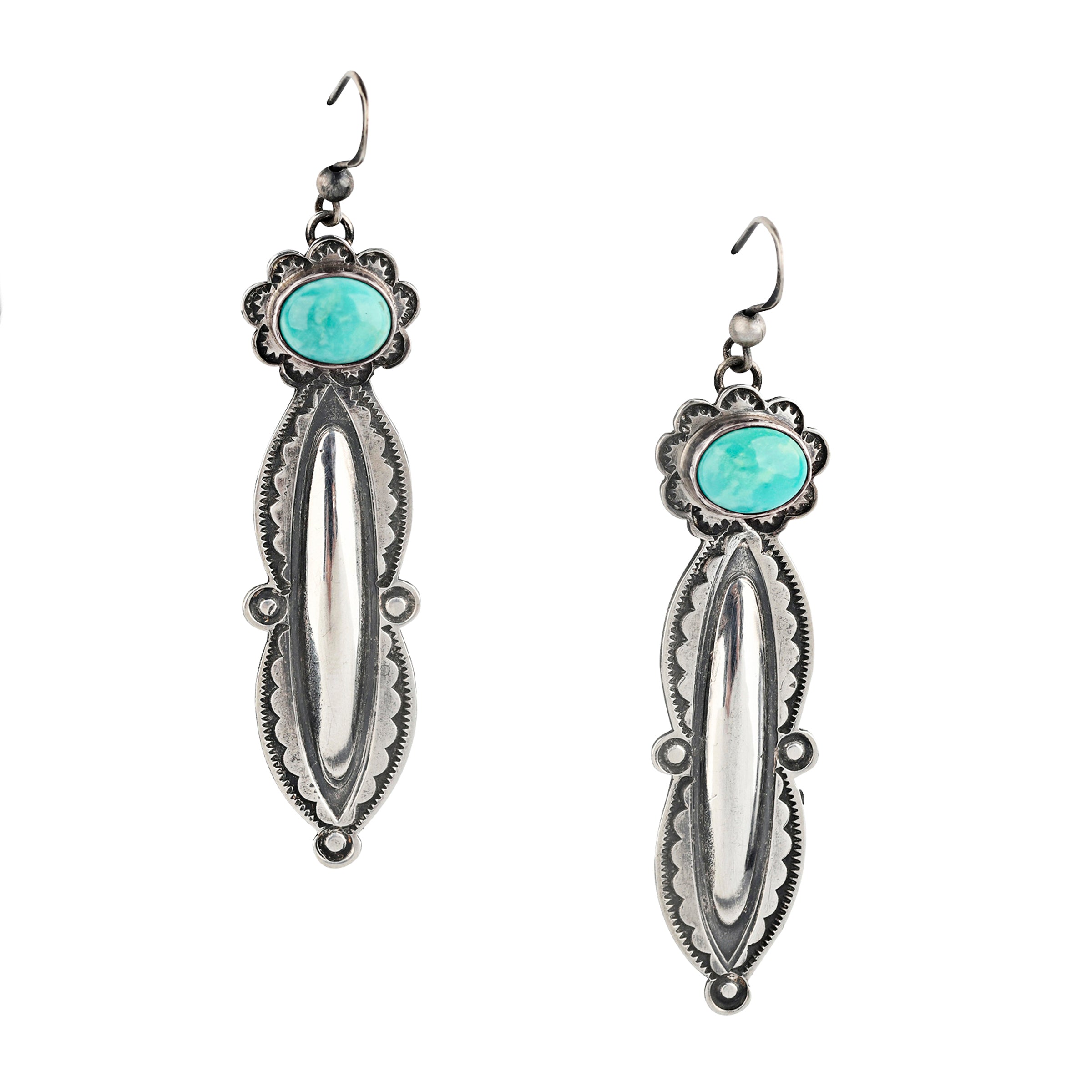 Pair of Sterling Silver, Santa Fe Style elongated stamped earrings topped with Turquoise.