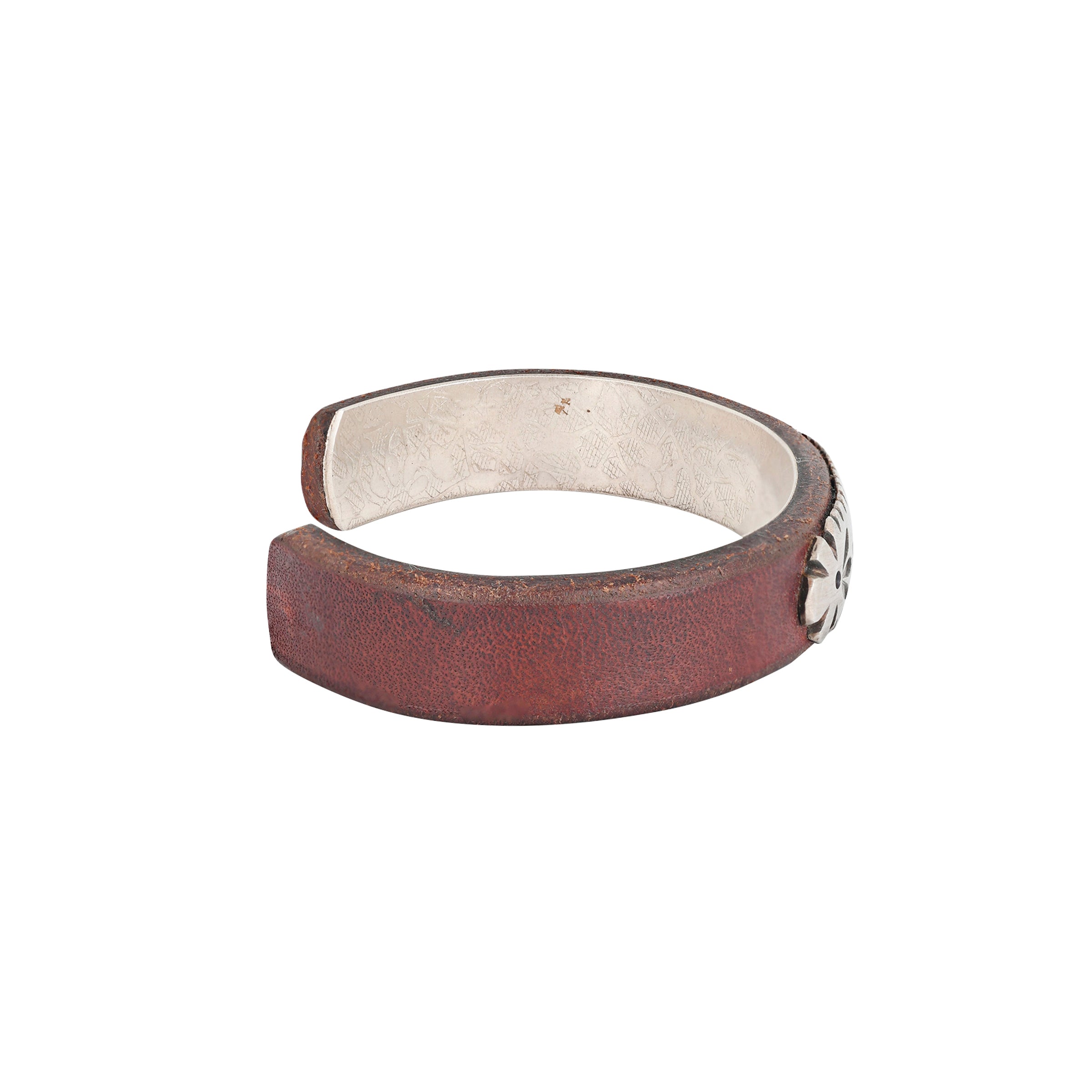 Sterling silver flower inlay detail over leather cuff side view