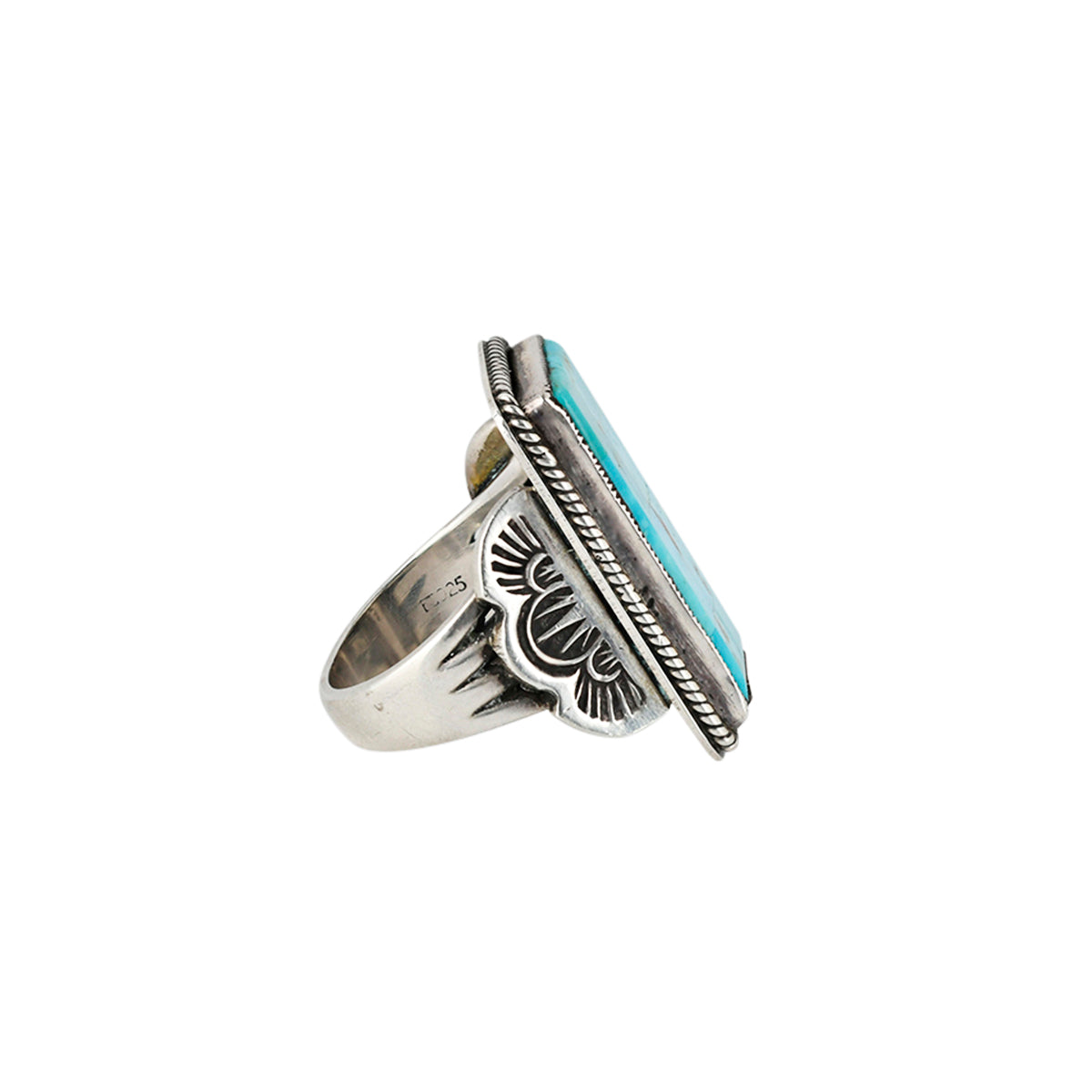Side view of sterling silver and turquoise ring with silver stamping details.