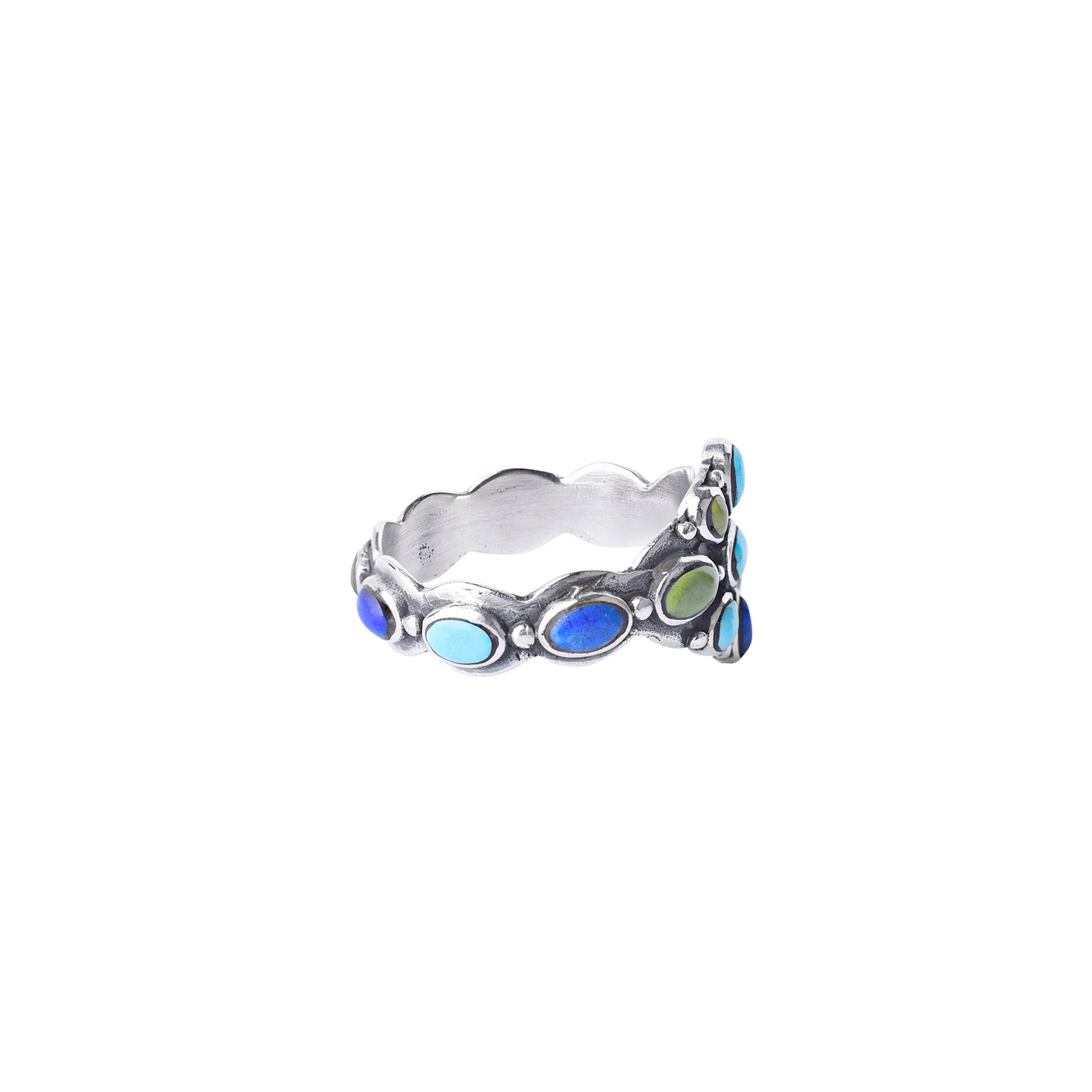 A Sterling Silver floral statement ring inlayed with a mix of Turquoise. The band of this ring is also inlayed with Turquoise the whole way around.