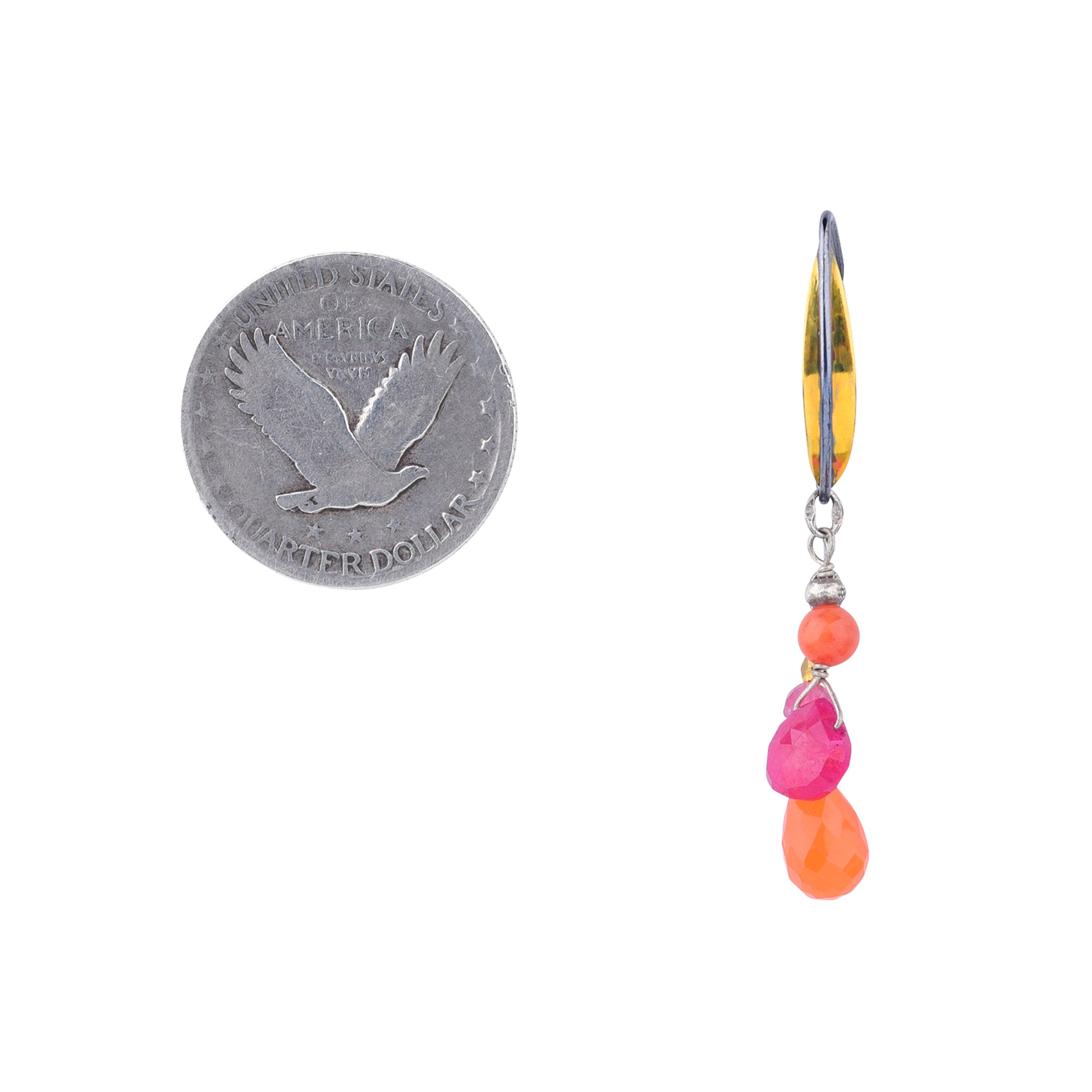 Brass and sterling silver ear wires with cascading orange carnelian and ruby earrings next to coin for scale