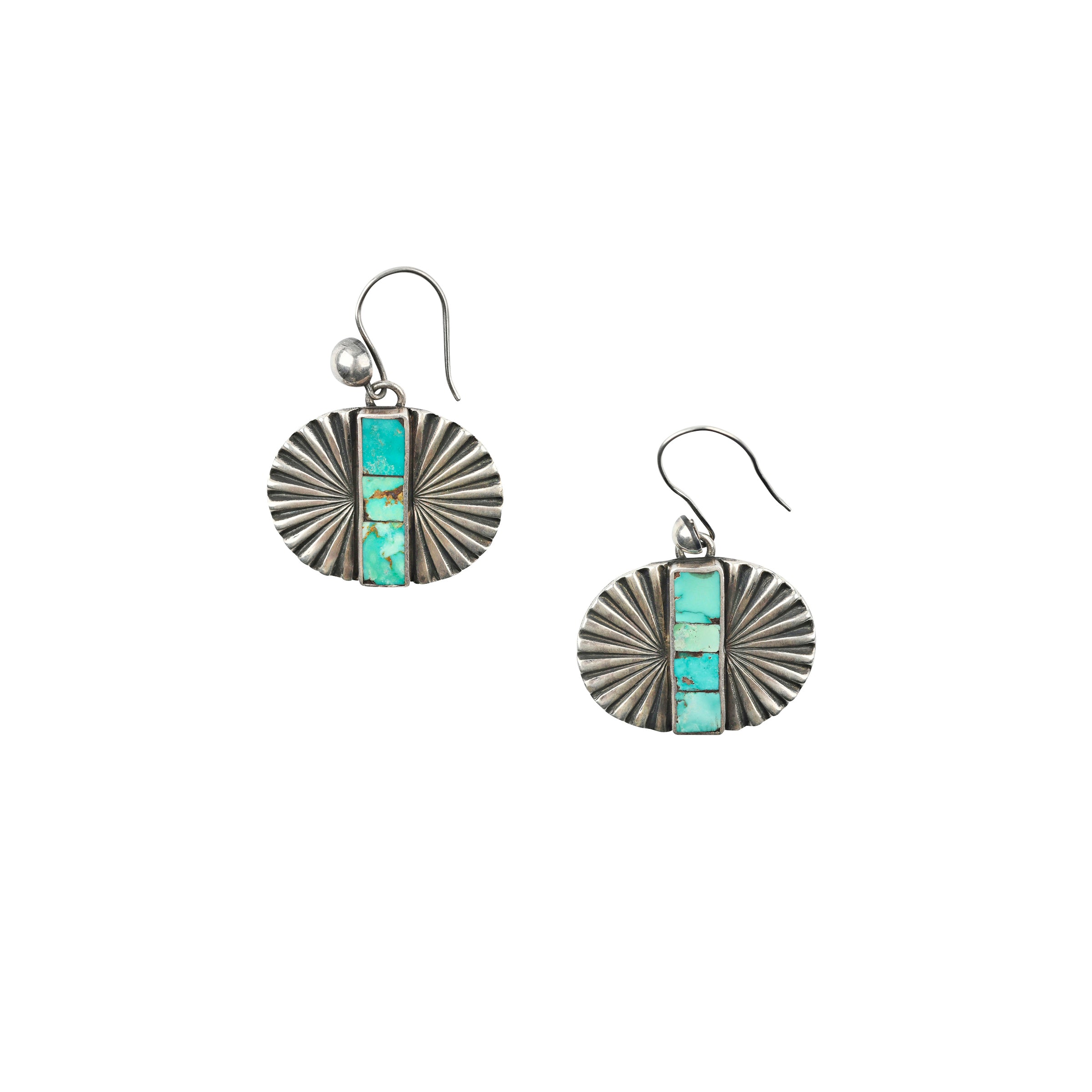 As seen in the Sundance Catalog, a pair of Sterling Silver cast earrings with Southwestern motifs featuring a strip of mosaic Turquoise in the middle