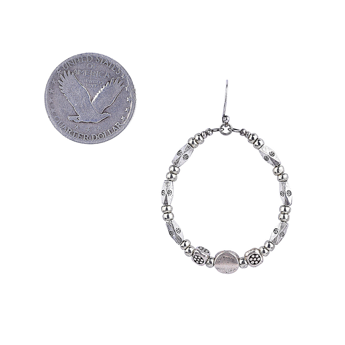 sterling silver hoop earrings with multiple sizes and textures of Thai beads next to coin for scale