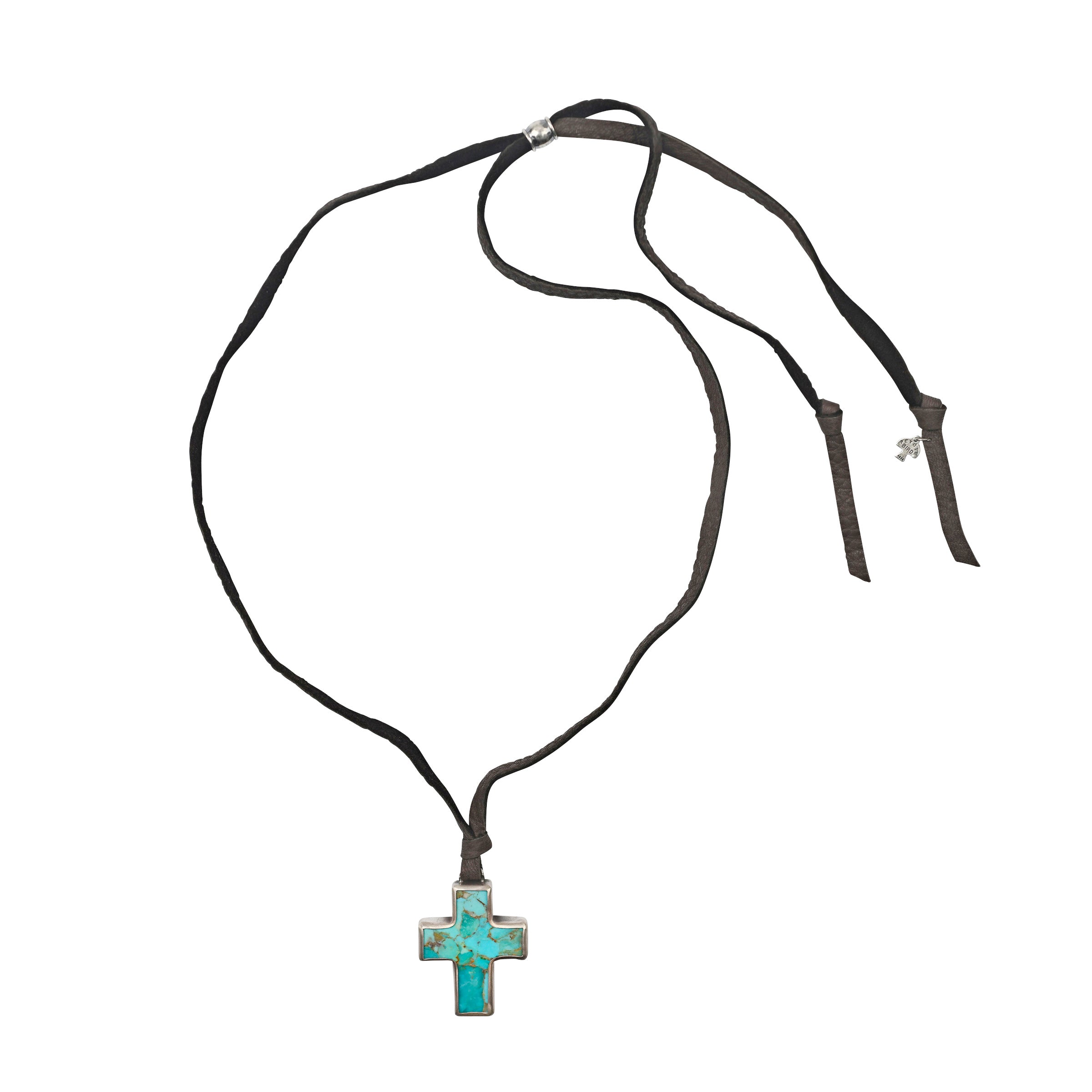 Faith Be With You Necklace is a stunning pendant necklace of a Cross carved from Blue Turquoise and lined with Sterling Silver. Strung on soft deerskin leather and finished with a Sterling Silver slider for a comfortable and adjustable fit.