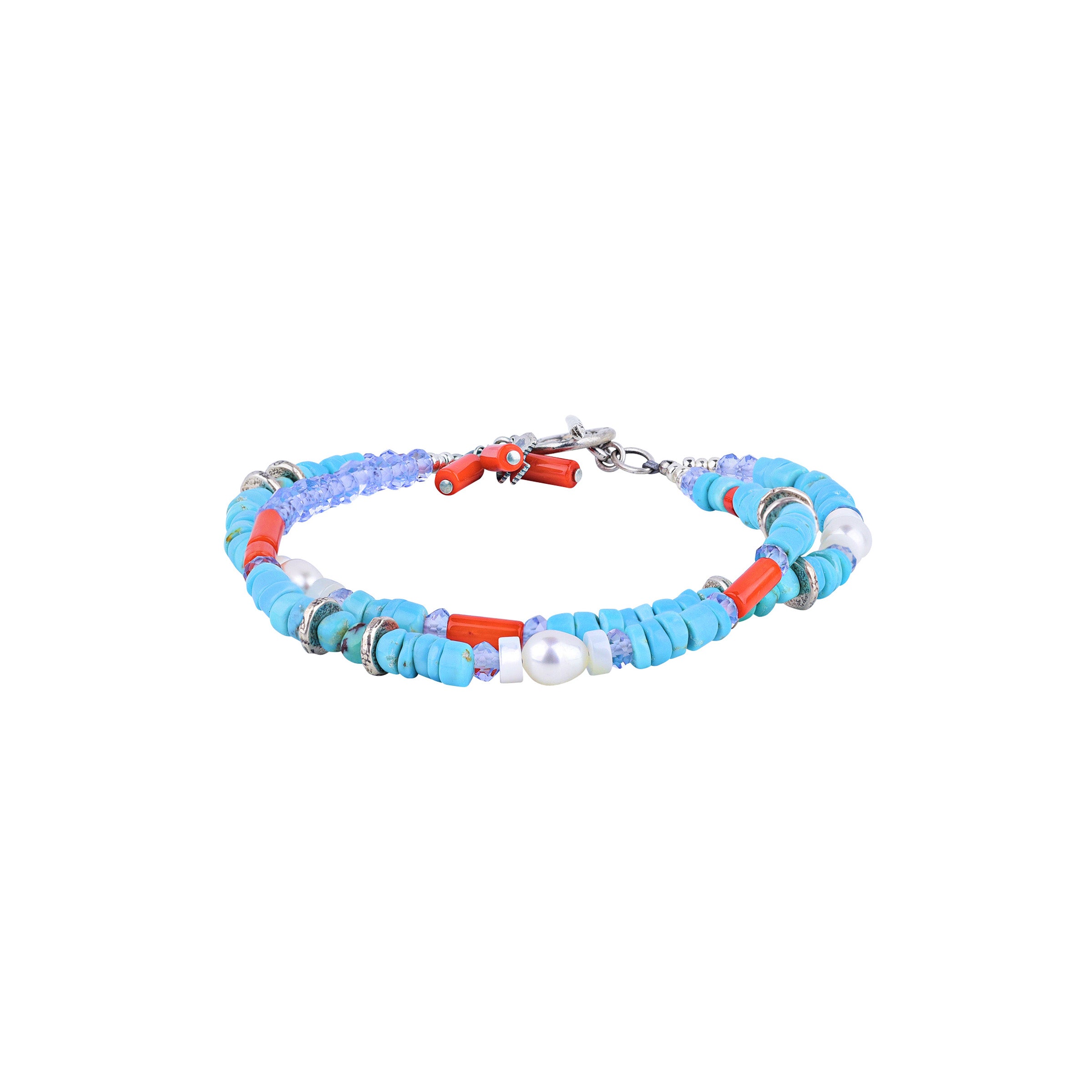 Experience the unique beauty of the waves with our Oceanus Bracelet. Adorned with delicate Mother of Pearl, Blue Turquoise, and Red Coral pieces. Peyote Bird Original. Made in USA.