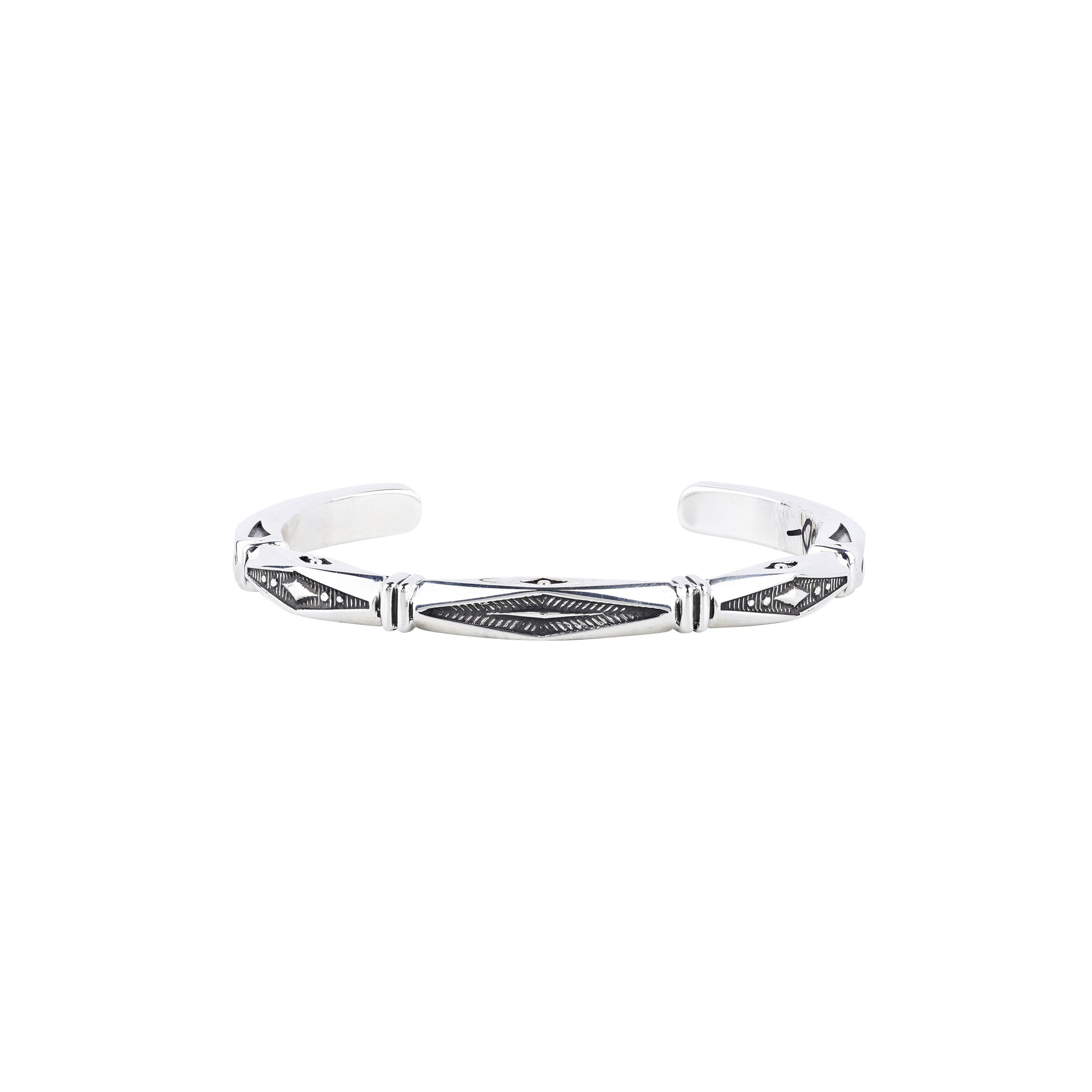 Silver bracelet stamped with textured diamond shapes and square banding.