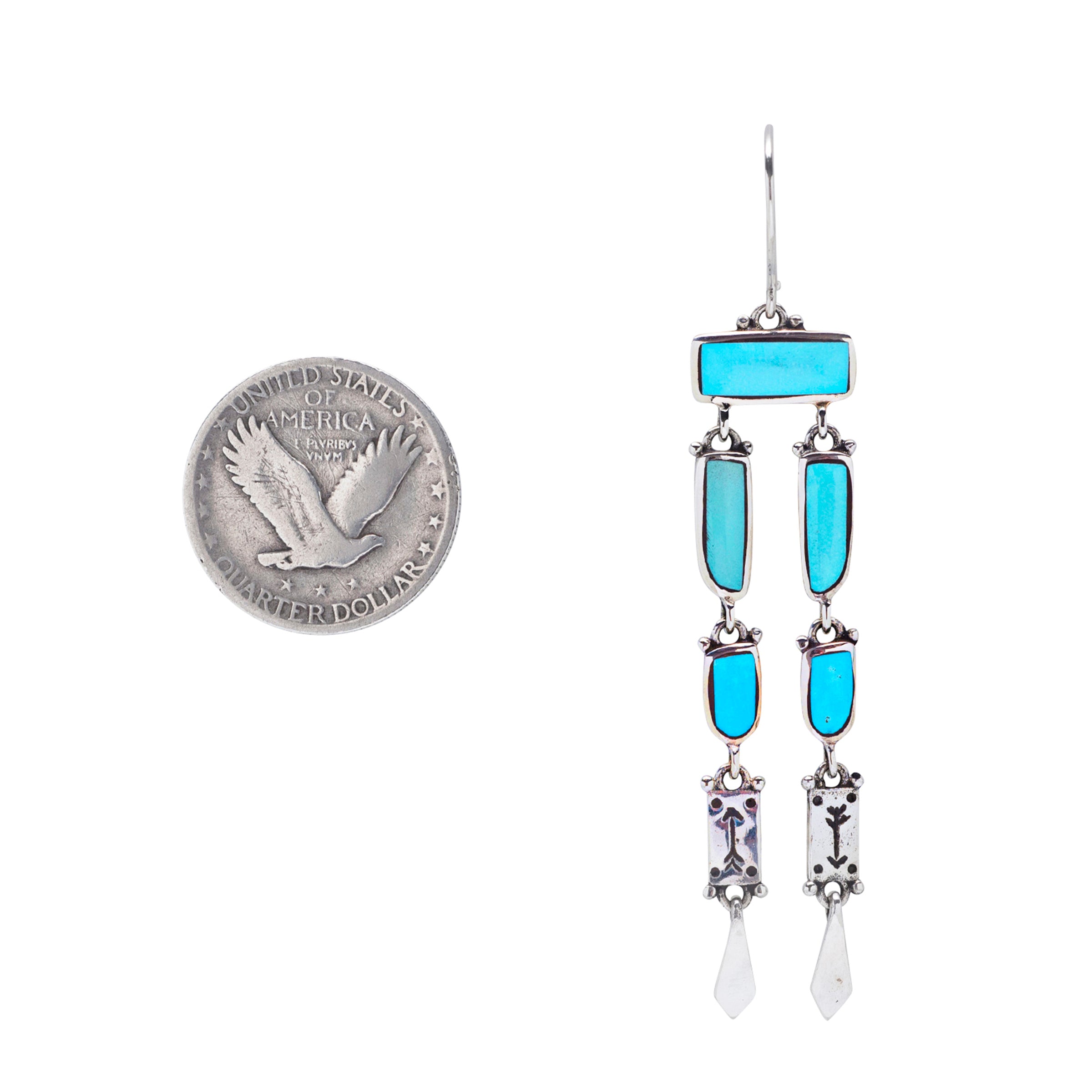 A pair of sterling silver dangle earrings with blue turquoise and stamped arrows in the silver near the bottom of the earrings.