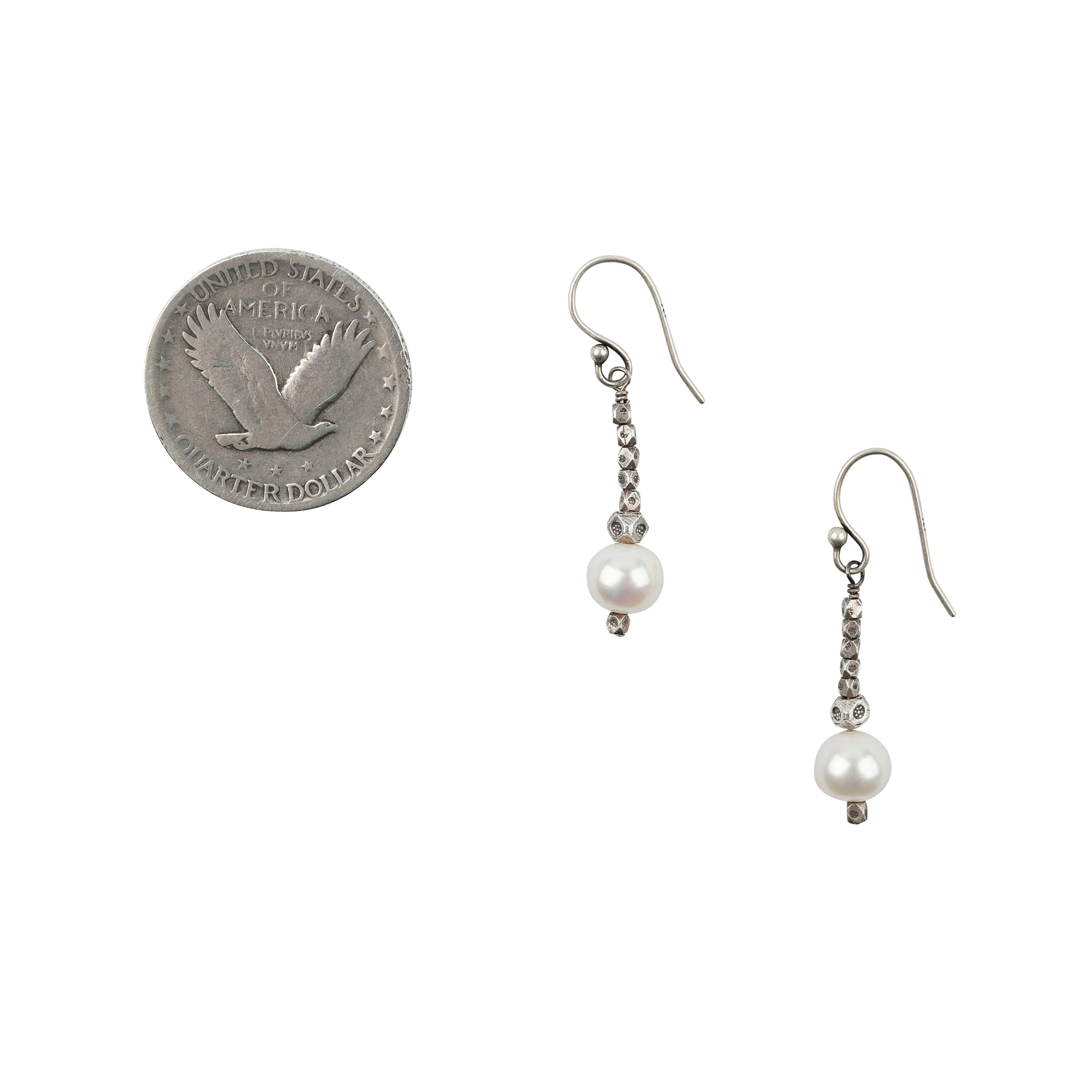 As seen in the Sundance Catalog, a pair of beaded drop earrings strung with Sterling Silver and finished with Pearl beading.