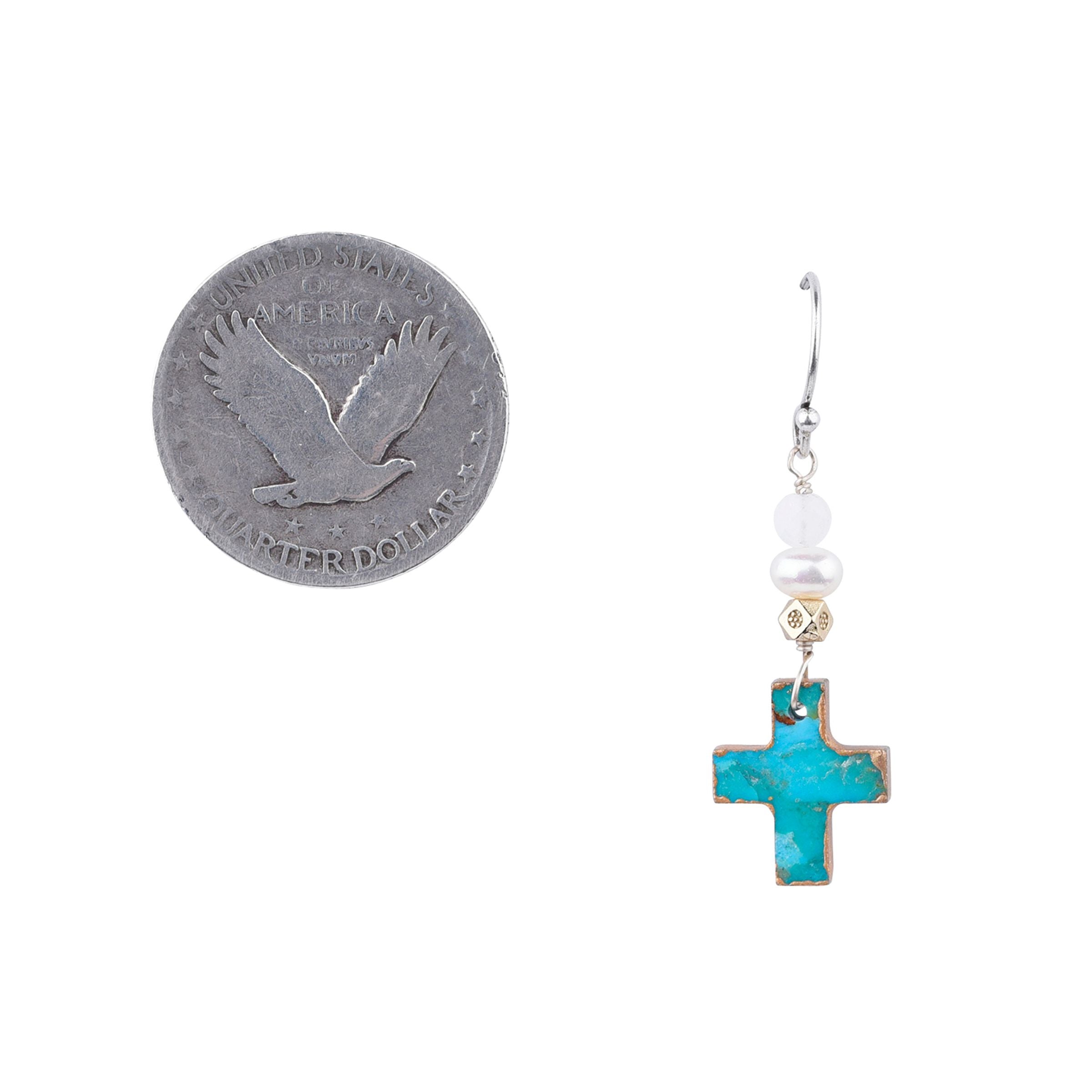 A pair of earrings featuring a turquoise cross design with silver and gold accents, attached to white hooks.