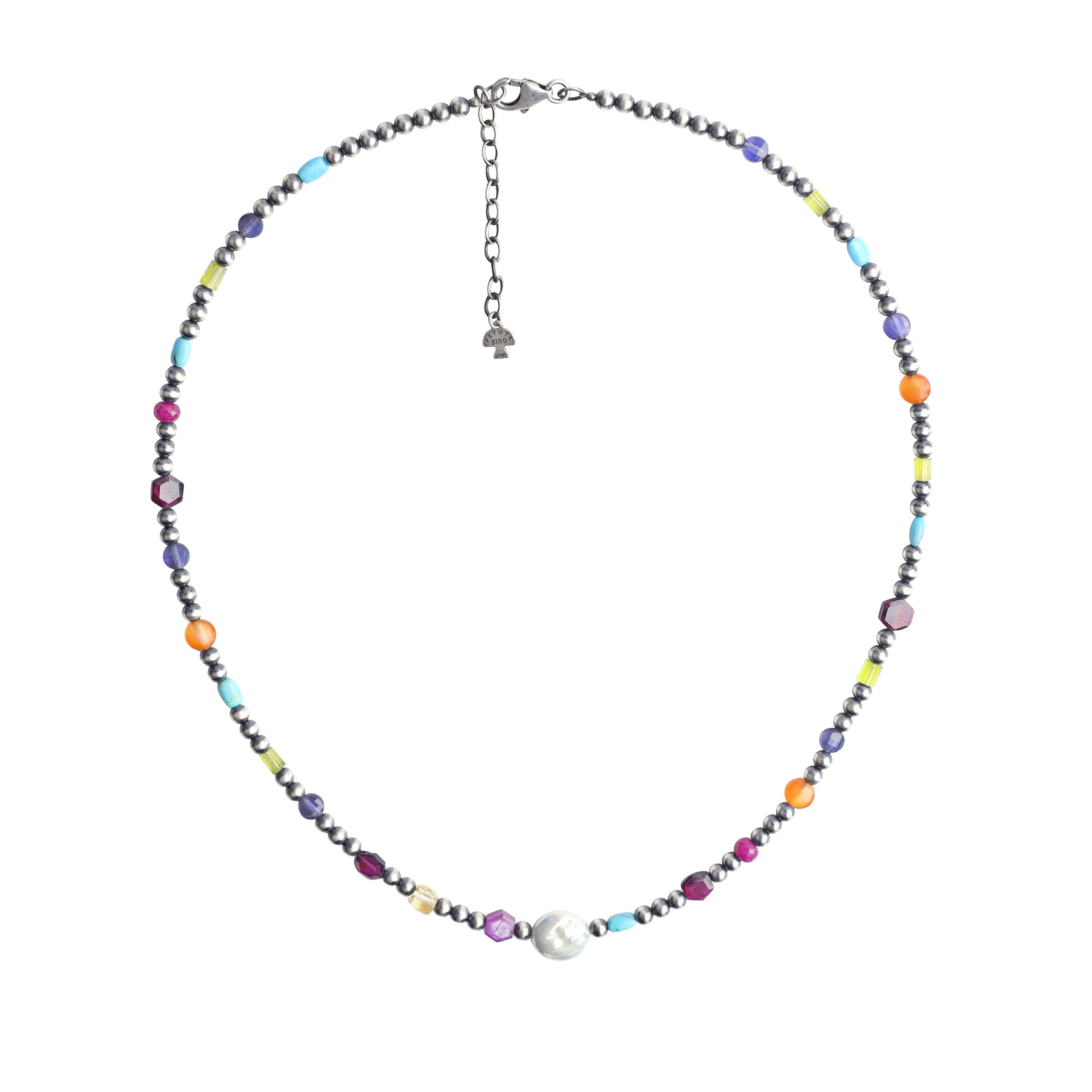 A handcrafted beaded necklace strung with Sterling Silver Desert Pearls, Pearl, Iolite, Blue Turquoise, Peridot, Carnelian, Garnet, Citrine, and Ruby. Finished with a lobster clasp and chain for adjustability.