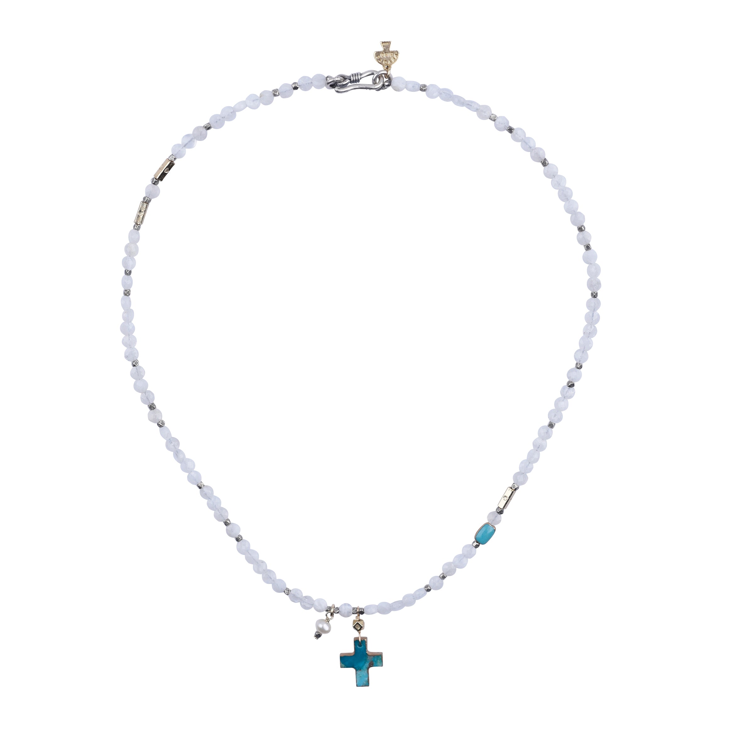 A necklace with a silver chain, gold accents, turquoise stones, and a small cross pendant.