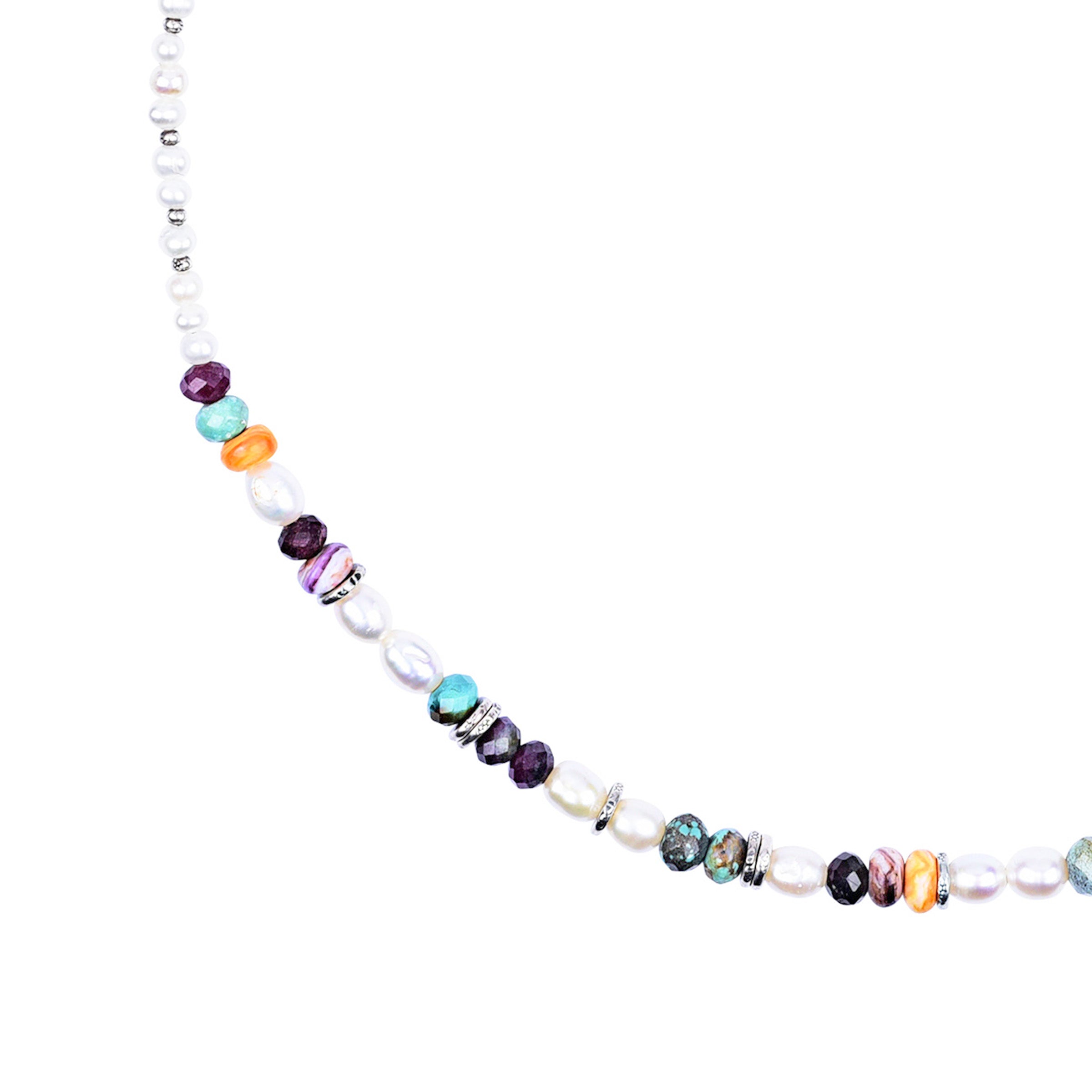 A boho style necklace featuring Pearl, Natural Turquoise, Tourmaline, Orange Spiny Oyster Shell, and Purple Spiny Oyster Shell
