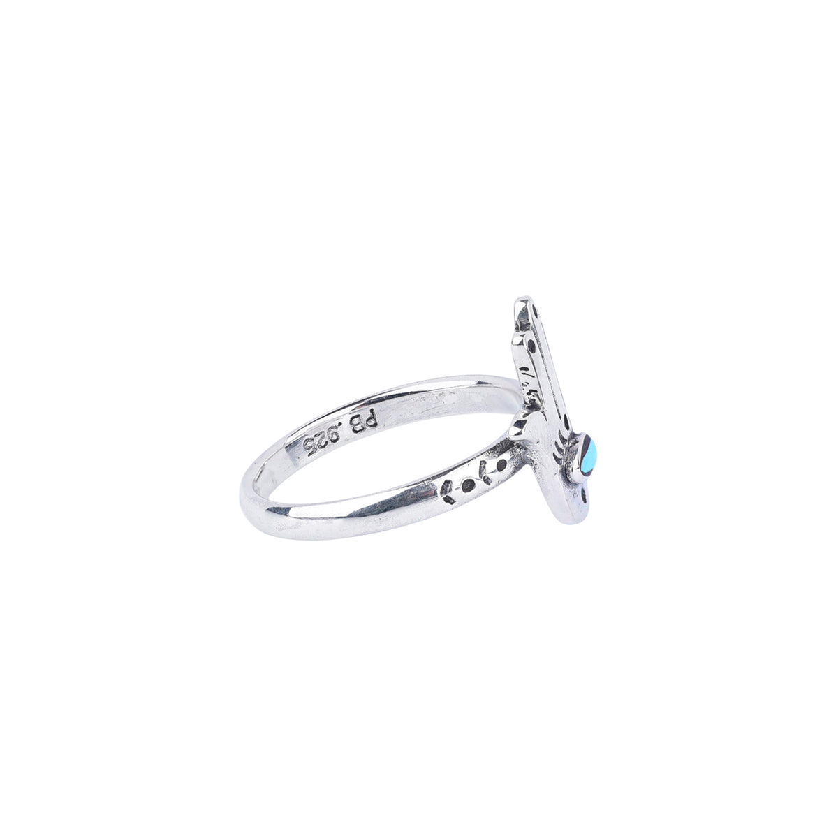 A sterling silver ring with a blue turquoise stone inlay in the shape of a hamsa symbol or hand and decorative stamping on the ring band.
