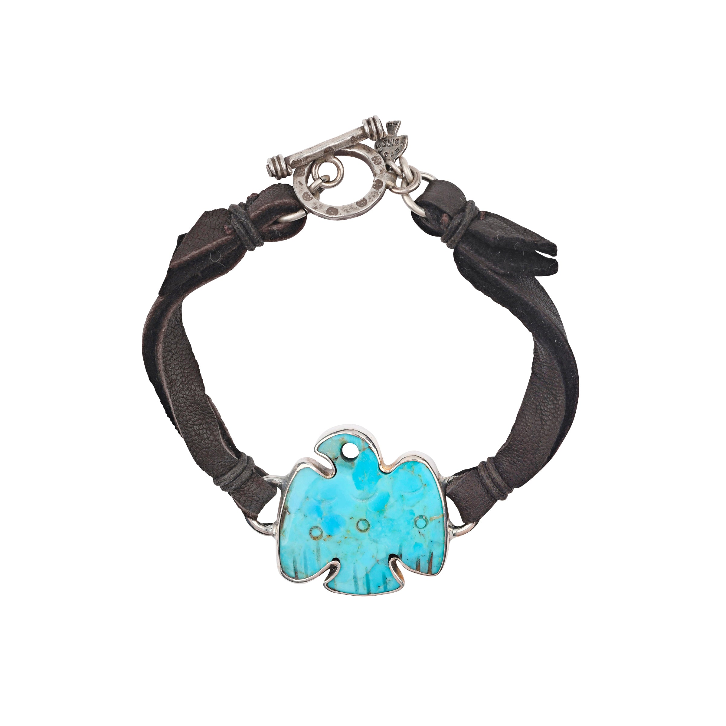 A unique bracelet featuring a hand-carved Turquoise Thunderbird strung on soft Deerskin Leather