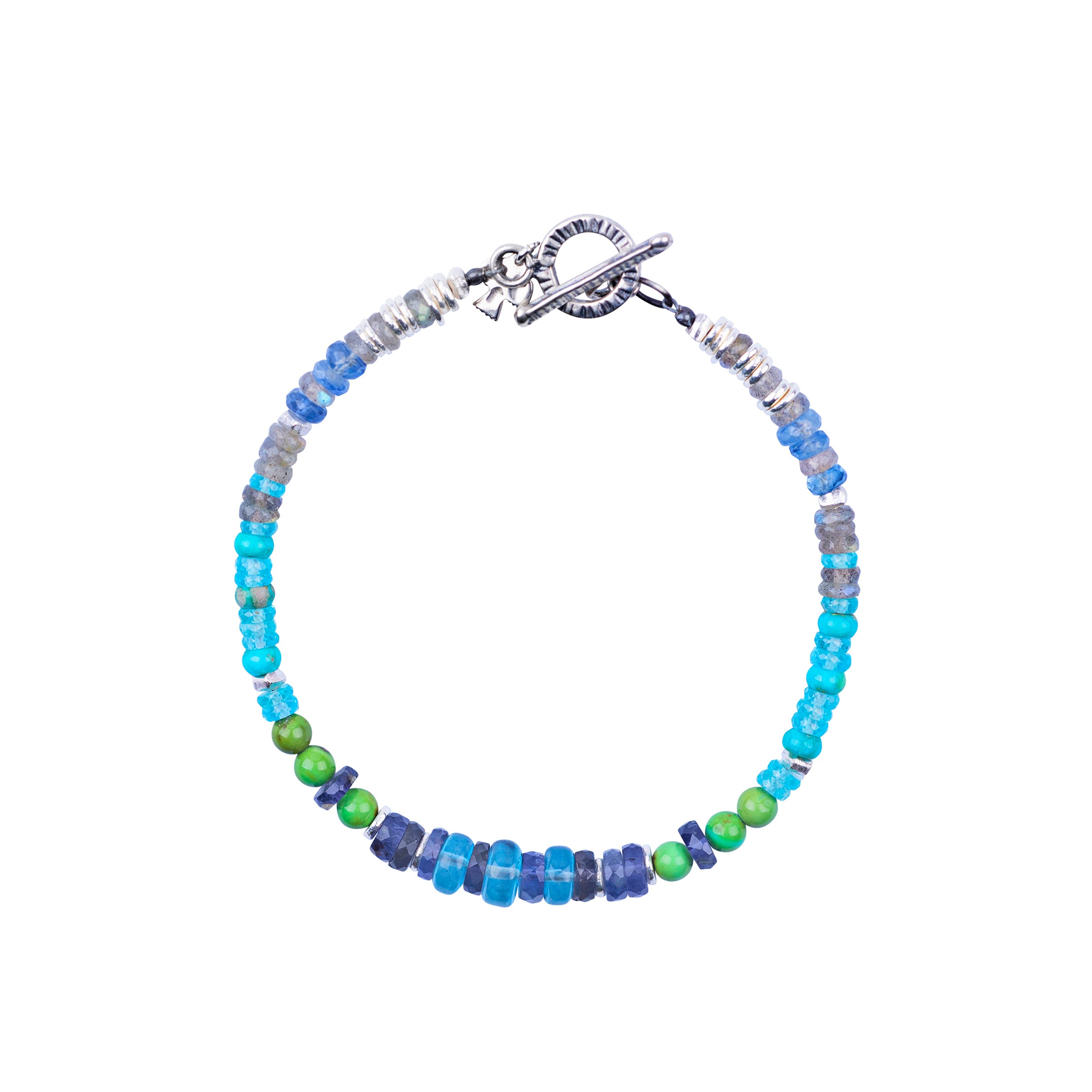 A Peyote Bird Original beaded bracelet strung with Labradorite, Iolite, Blue Turquoise, Green Turquoise, Kyanite, Blue Crystal, and Apatite. Finished with a Sterling Silver toggle clasp for a stylish fit