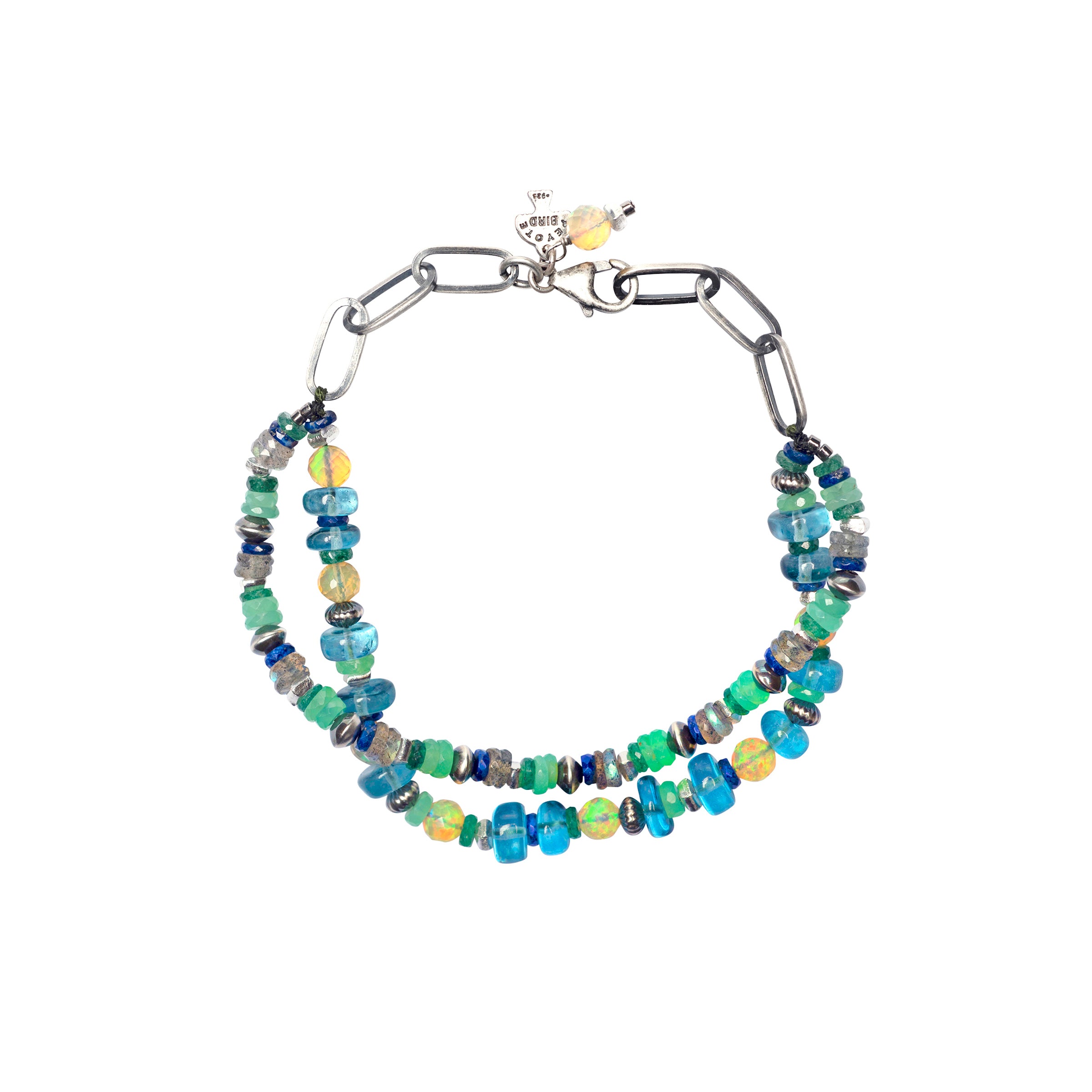 A Peyote Bird Original beaded and chain bracelet strung with Lapis, Chrysoprase, Blue Crystal, Ethiopian Yellow Opal, Emerald, and Labradorite. Finished with a lobster clasp for a secure fit.
