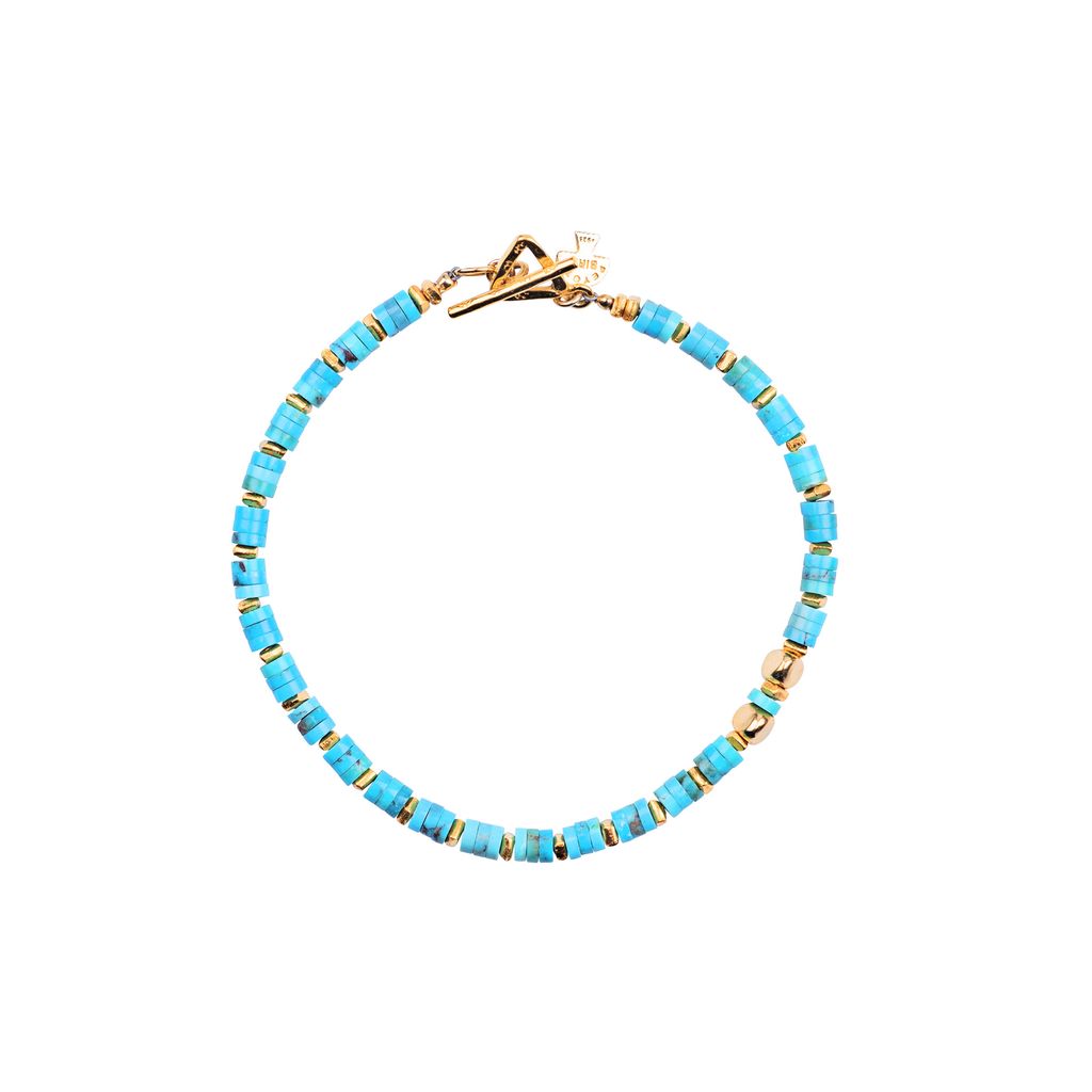 A bracelet with gold plate and blue turquoise beads, featuring a bold pattern and a gold plate clasp.