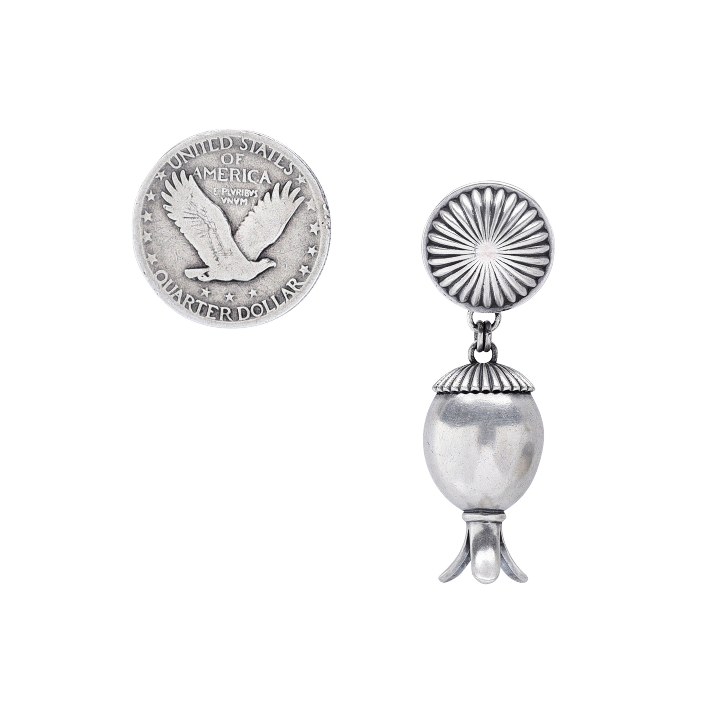 A pair of silver earrings featuring a fluted pattern atop acorn squash blossoms, by artist Dennis Hogan.