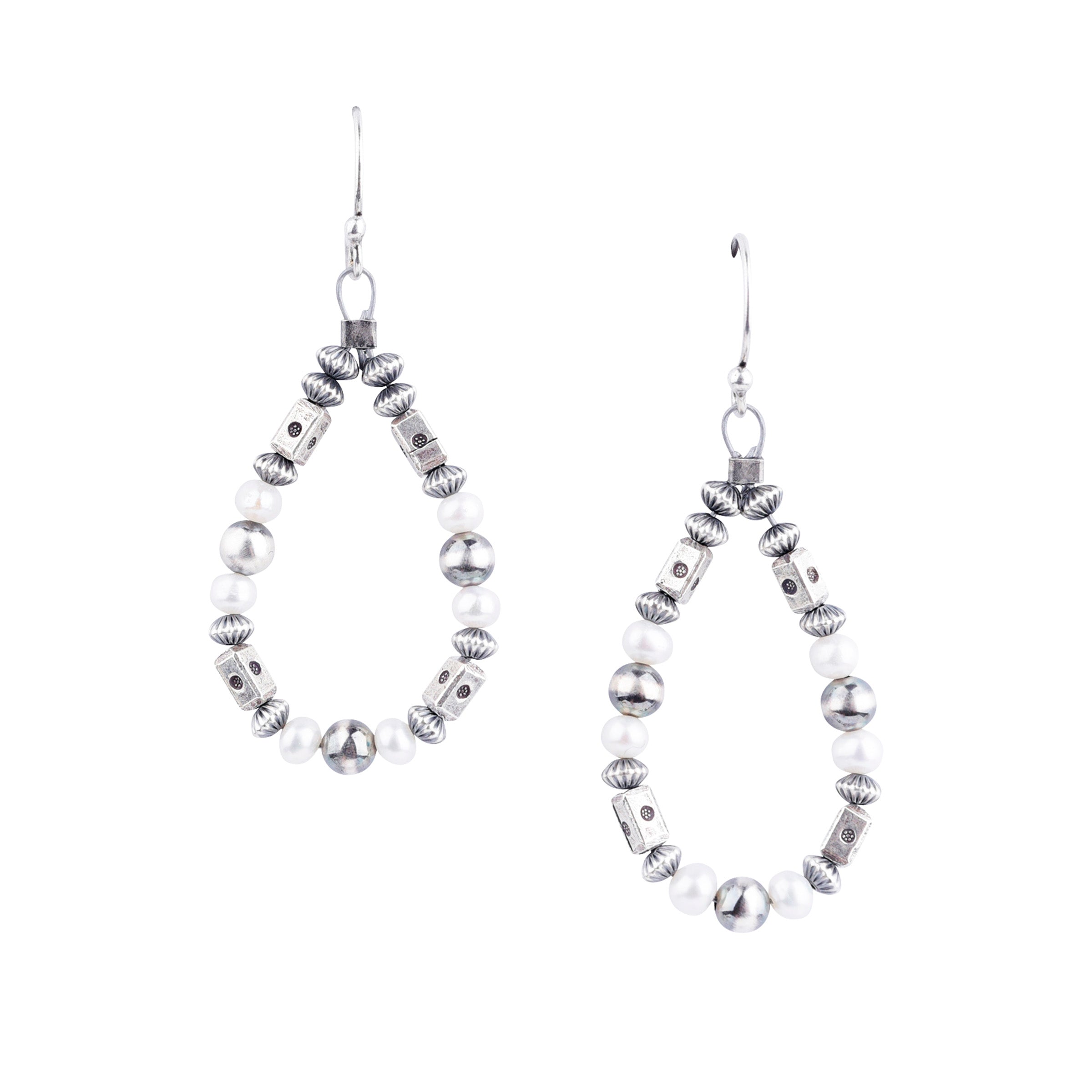 Our O'Keeffe Earrings are adorned with desert pearls, sterling silver embellishments, and your choice of coral, pearl, or turquoise beading, or stick with just sterling silver!