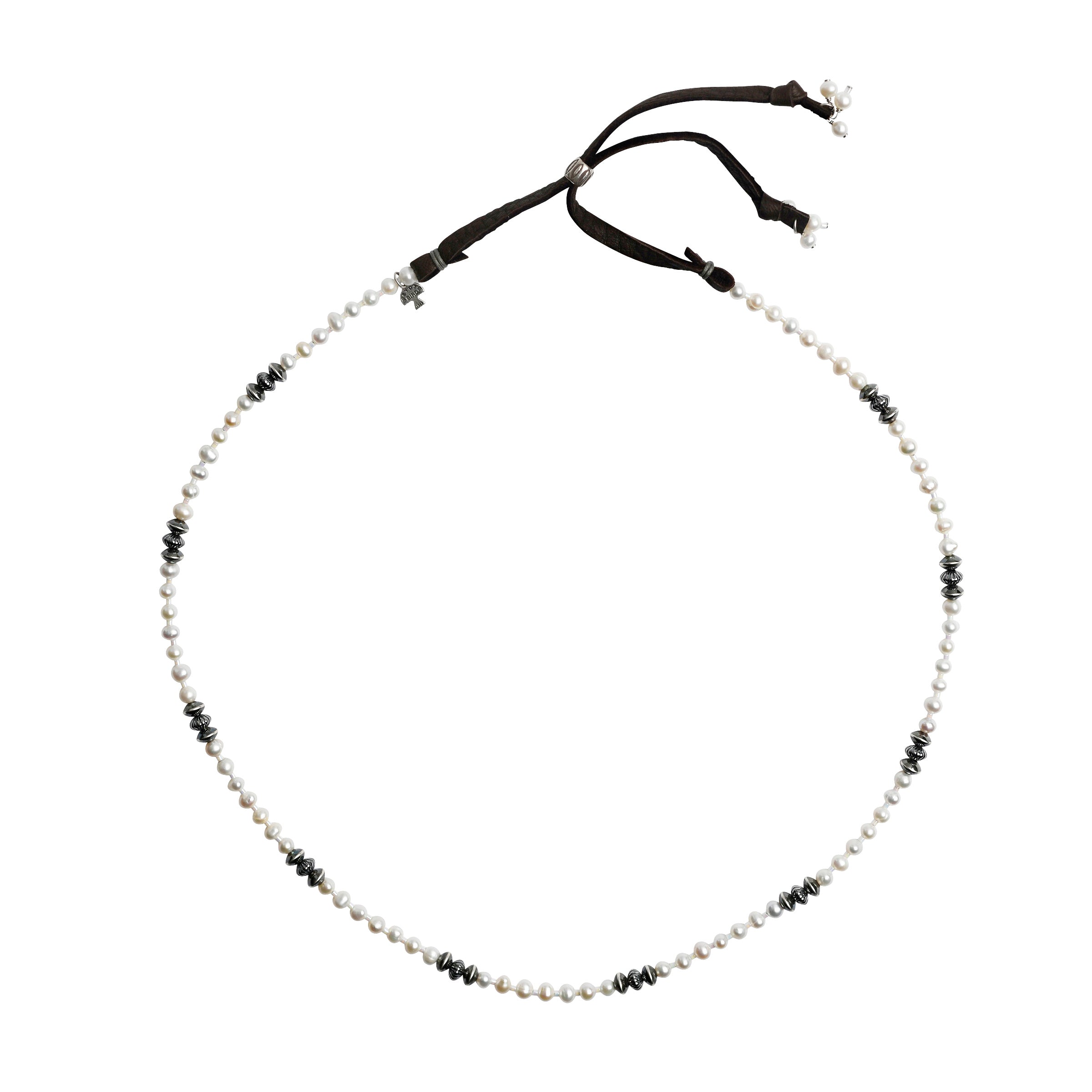 White pearls and sterling silver saucer beads mixed together with brown deerskin leather and sterling silver slider bead with pearl charms.