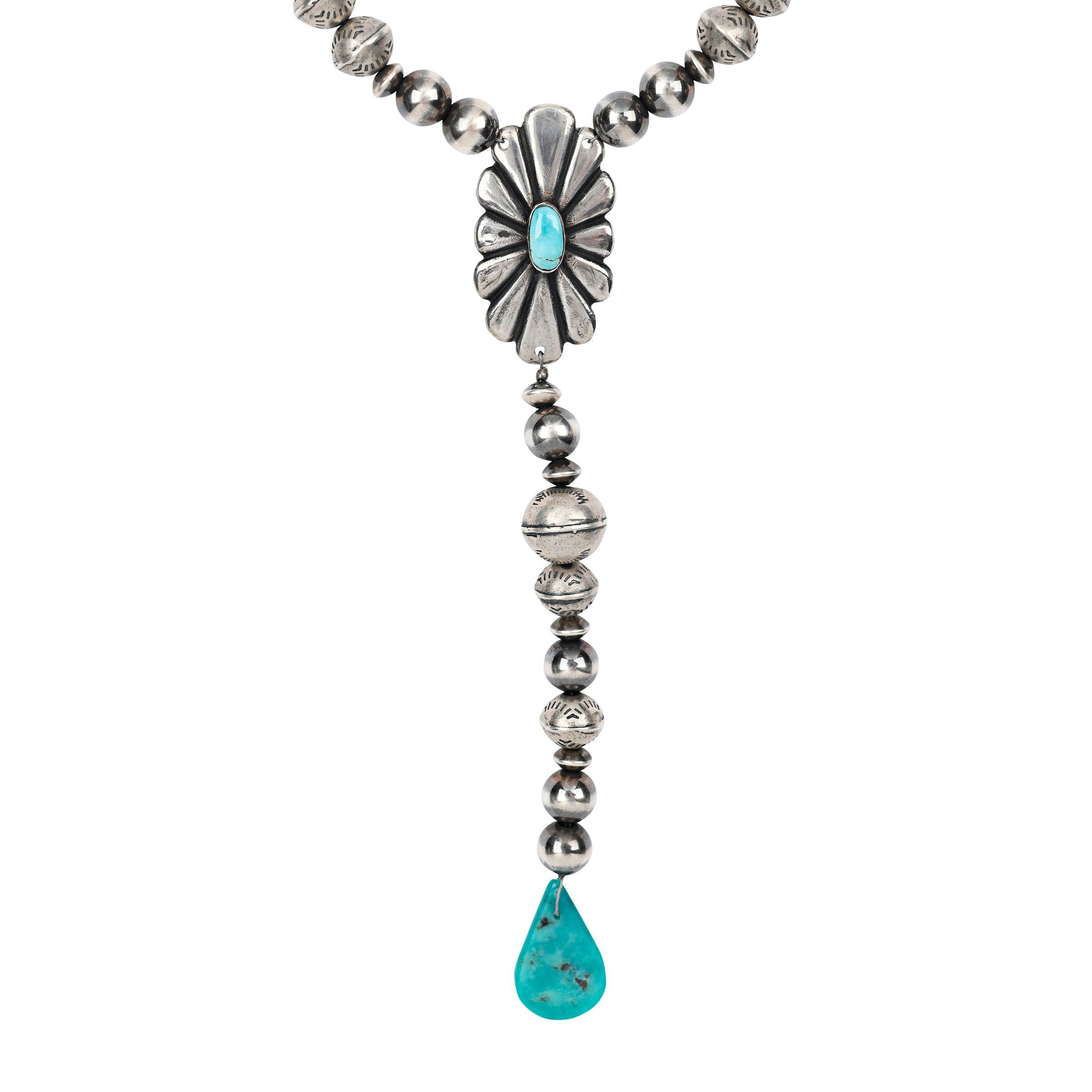 A Sundance staple piece - this y-neck necklace is made with Sterling Silver featuring a large Concho piece with Turquoise accents strung with Desert Pearls and vintage-style stamped Sterling Silver beading.