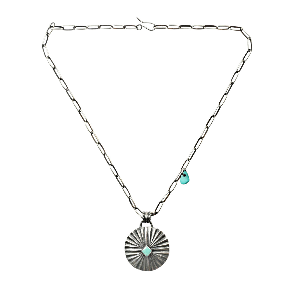 Large Sterling Silver, sunburst type pendant featuring Blue Turquoise on unique chain.