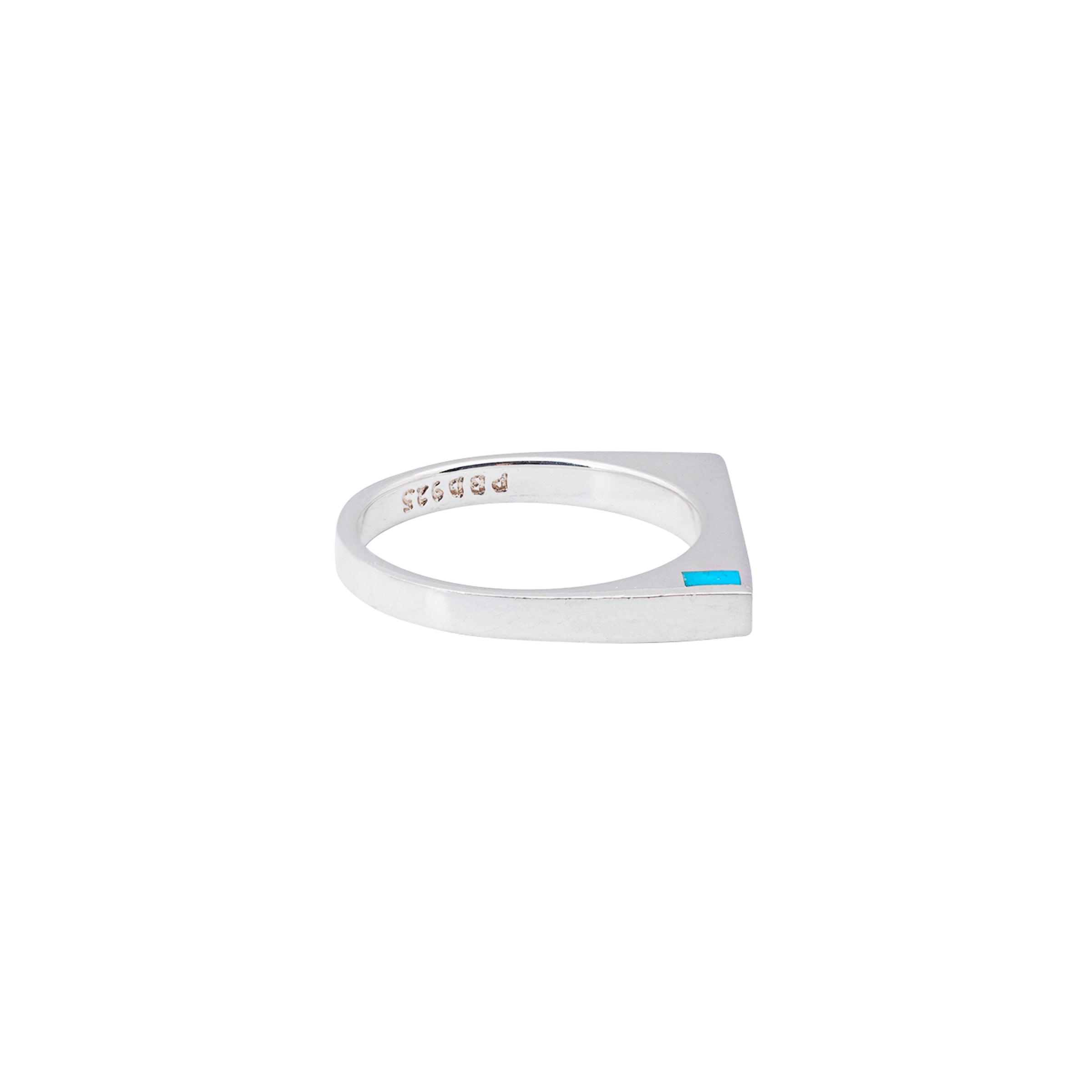 A sleek design of Sterling Silver and Blue Turquoise. A simple square ring perfect for stacking