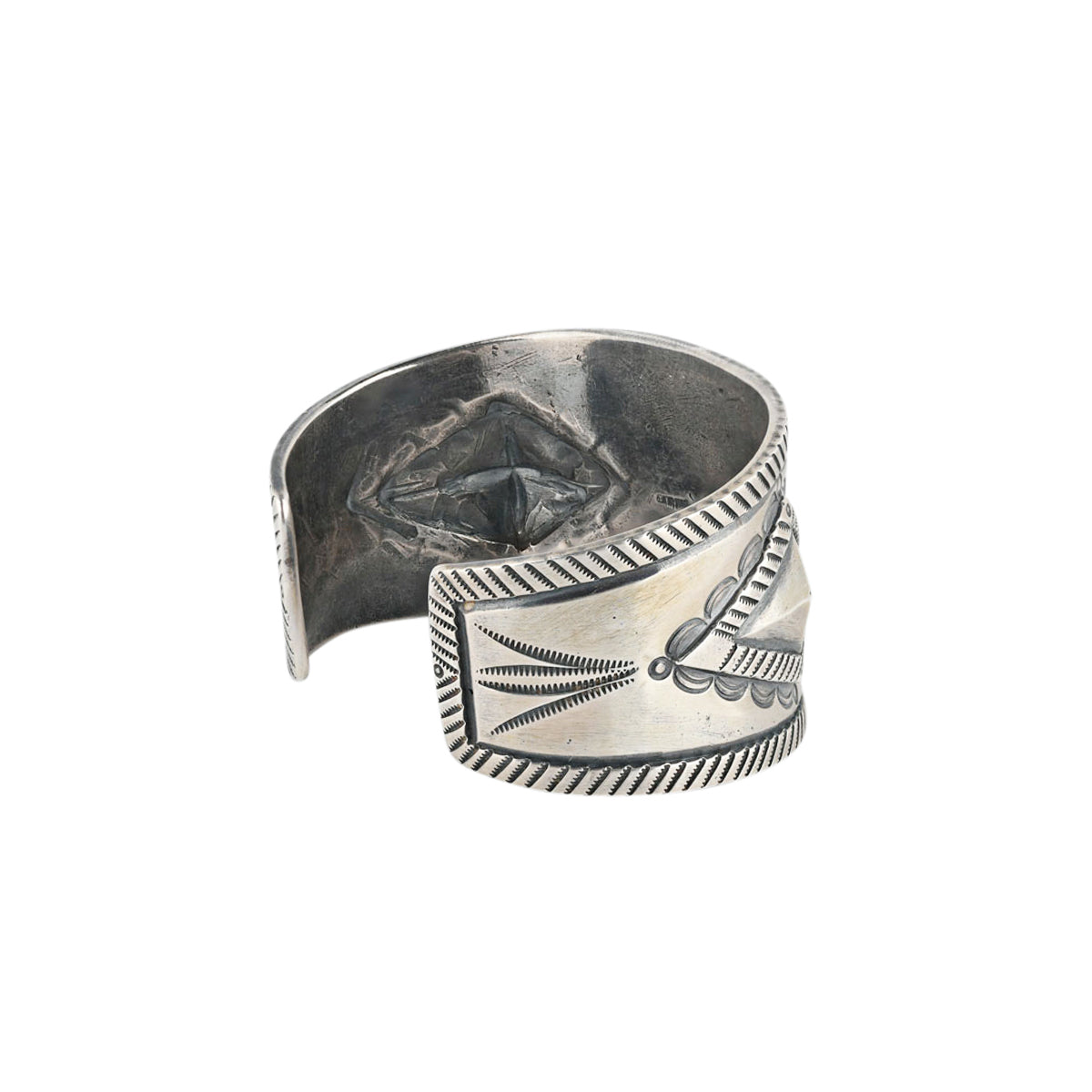 A men's cuff handcrafted by Jesse Robbins from ingot coin silver and features a stunning blue turquoise stone and evokes Santa Fe style