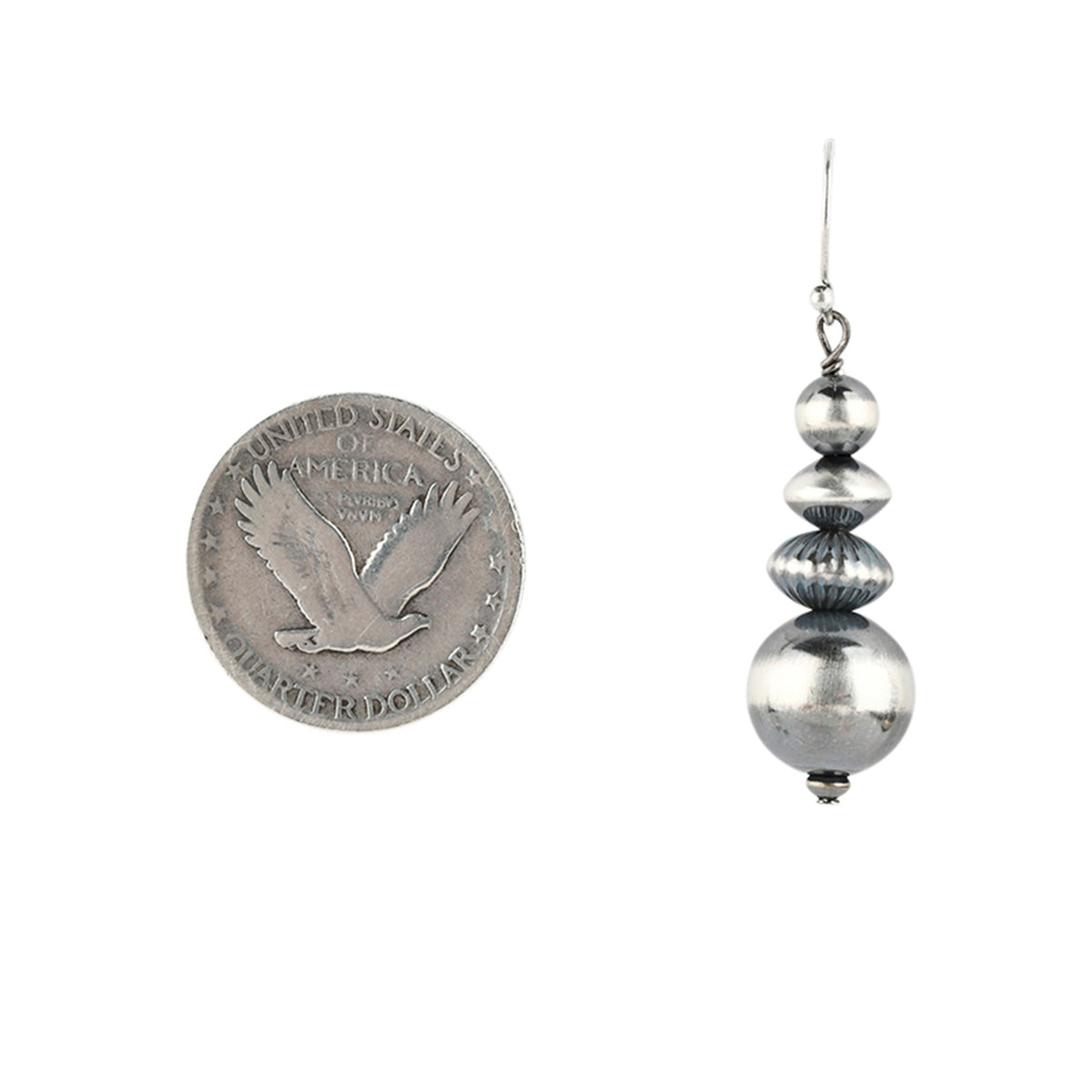 Stacked beaded sterling silver bead earring next to coin for scale