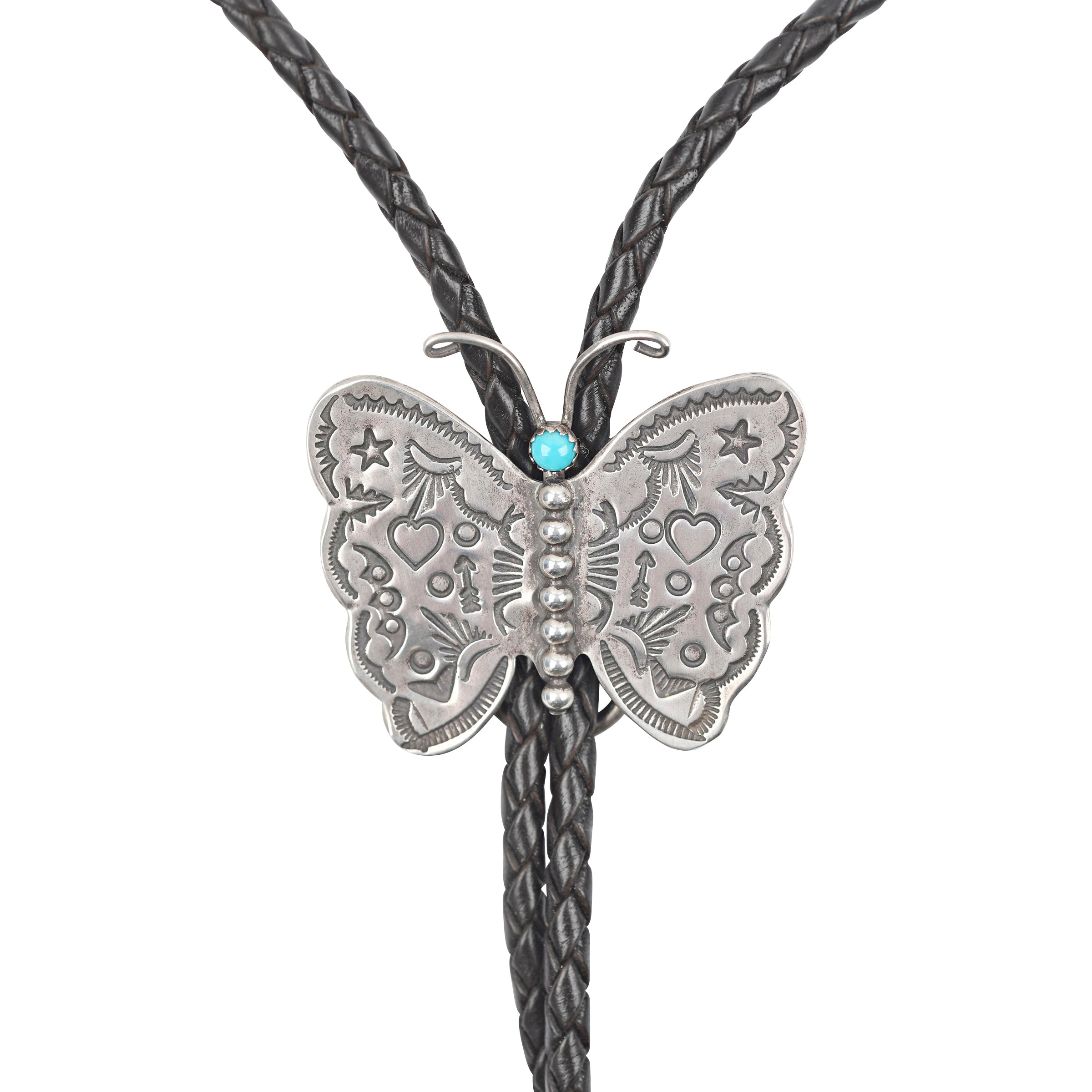 Butterfly-shaped pendant on a bolo tie against a white background